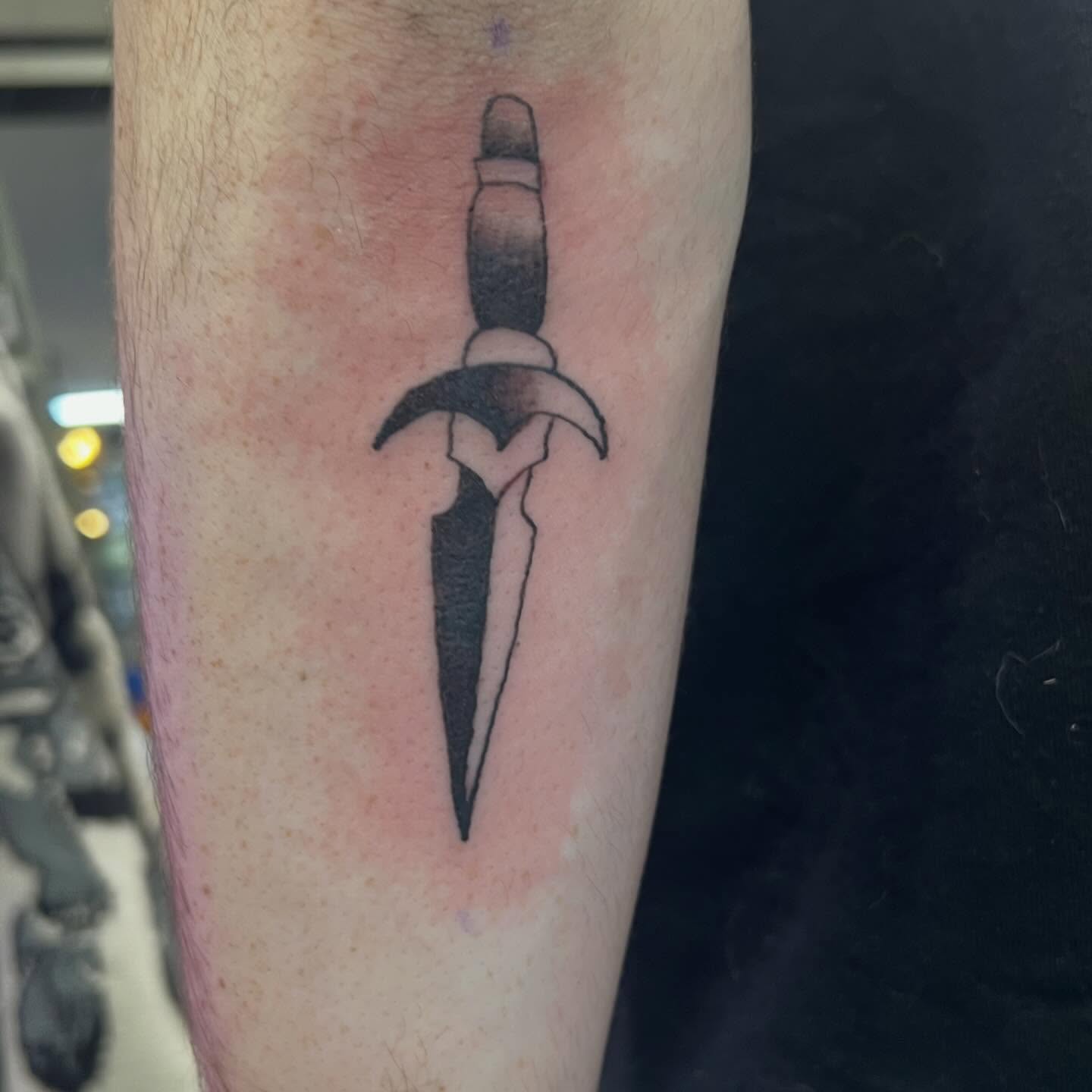 Dagger black and grey tattoo on the forearm by Tomfoolery