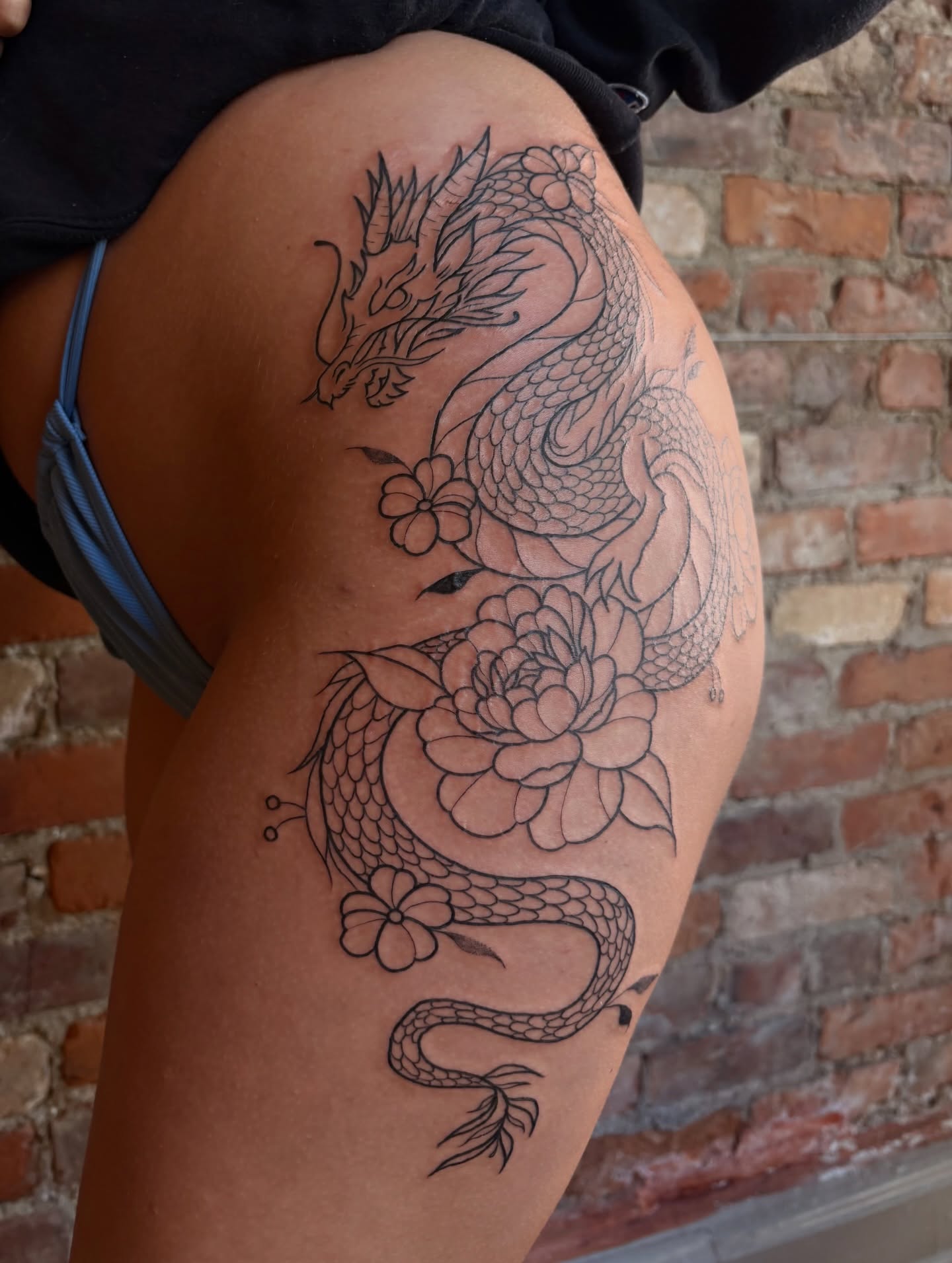 Dragon and flowers black and grey tattoo on the thigh by Jen Osborne ♡ Cincinnati Tattoo Artist