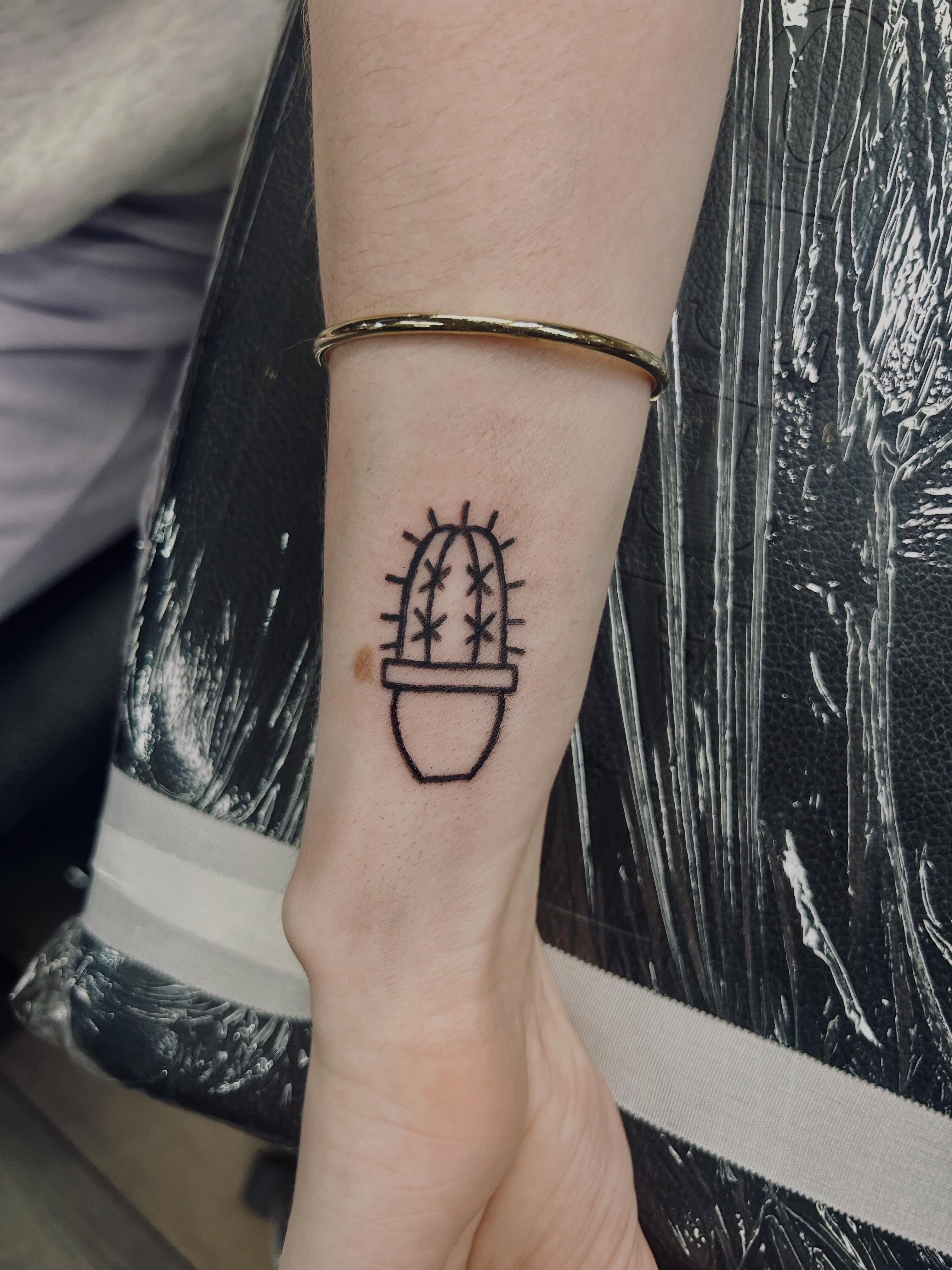 Cactus minimalist tattoo on the forearm by Bjorn Bjornstad, Dubuque, Iowa