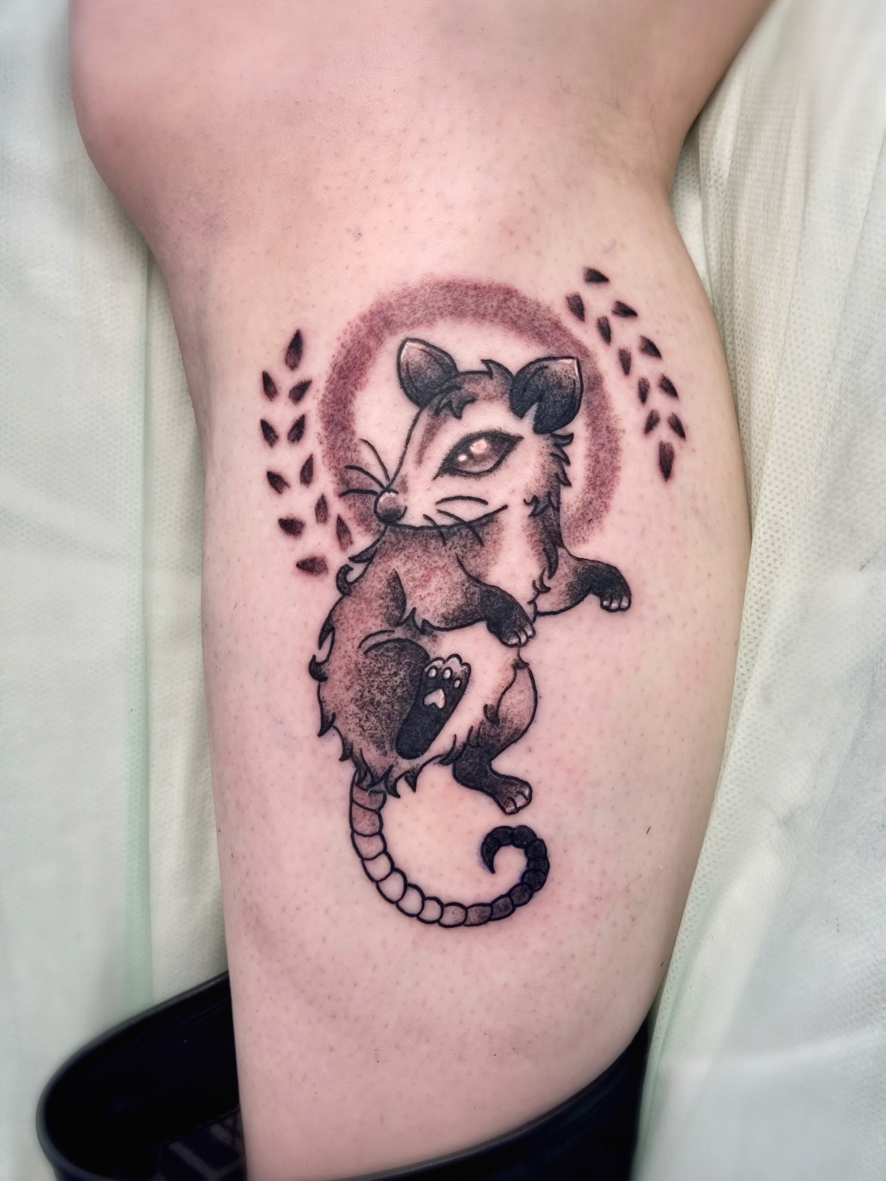 Possum and seahorse black and grey tattoo on the forearm by Shay Cole
