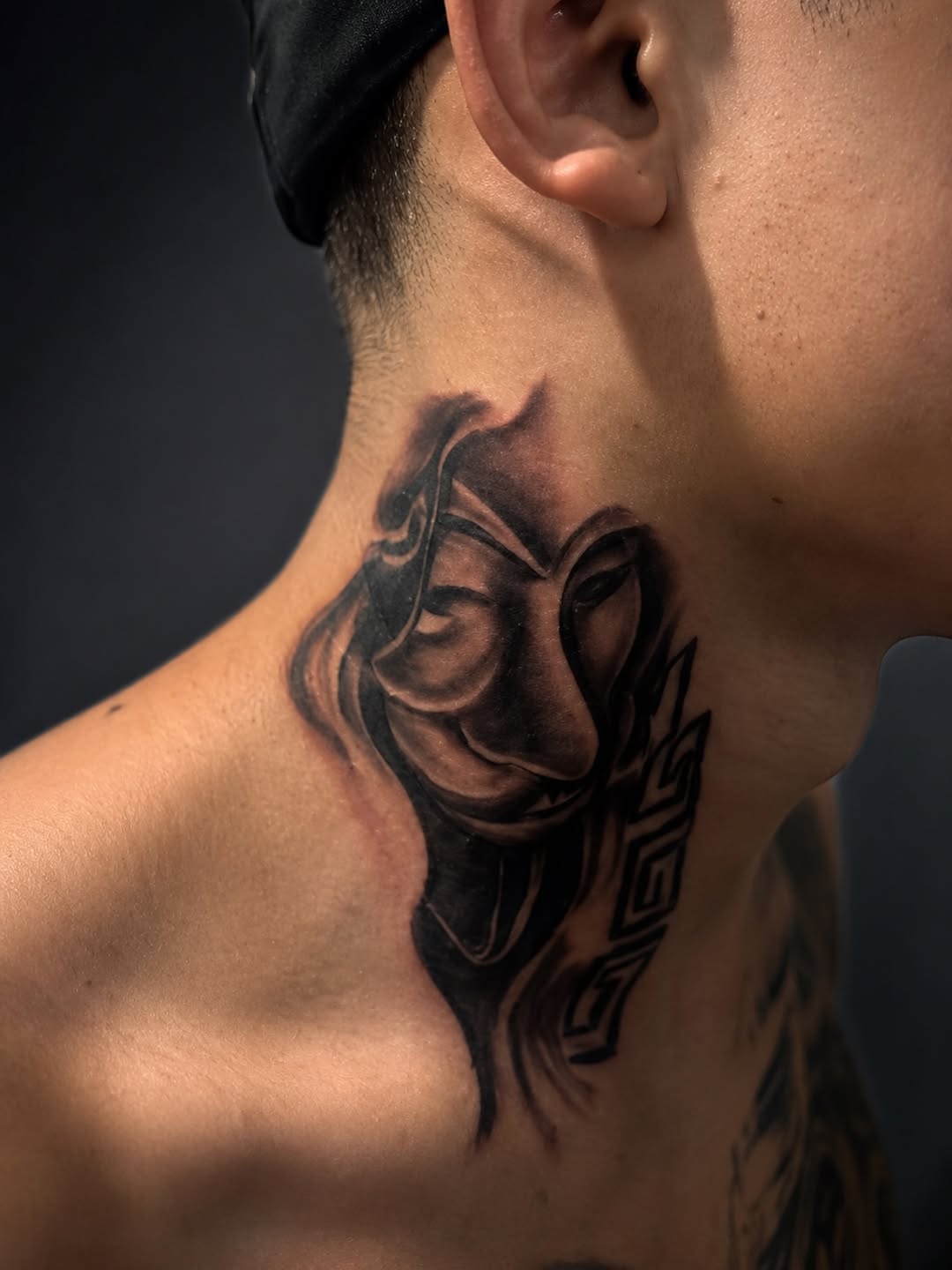 Mask with tribal elements realism tattoo on the neck by Mauricio gois