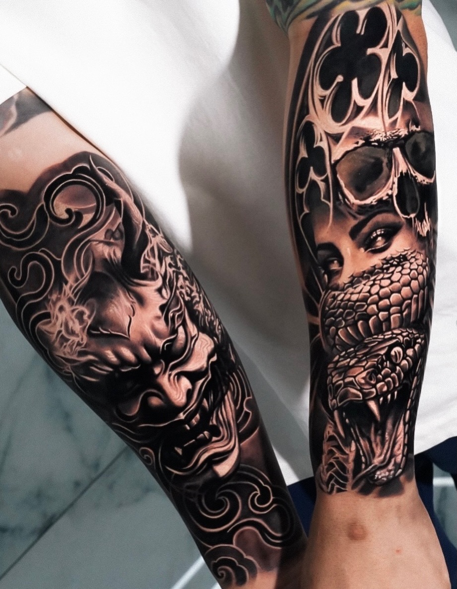Demon mask and snake with skull Japanese tattoo on the forearm by George Lange