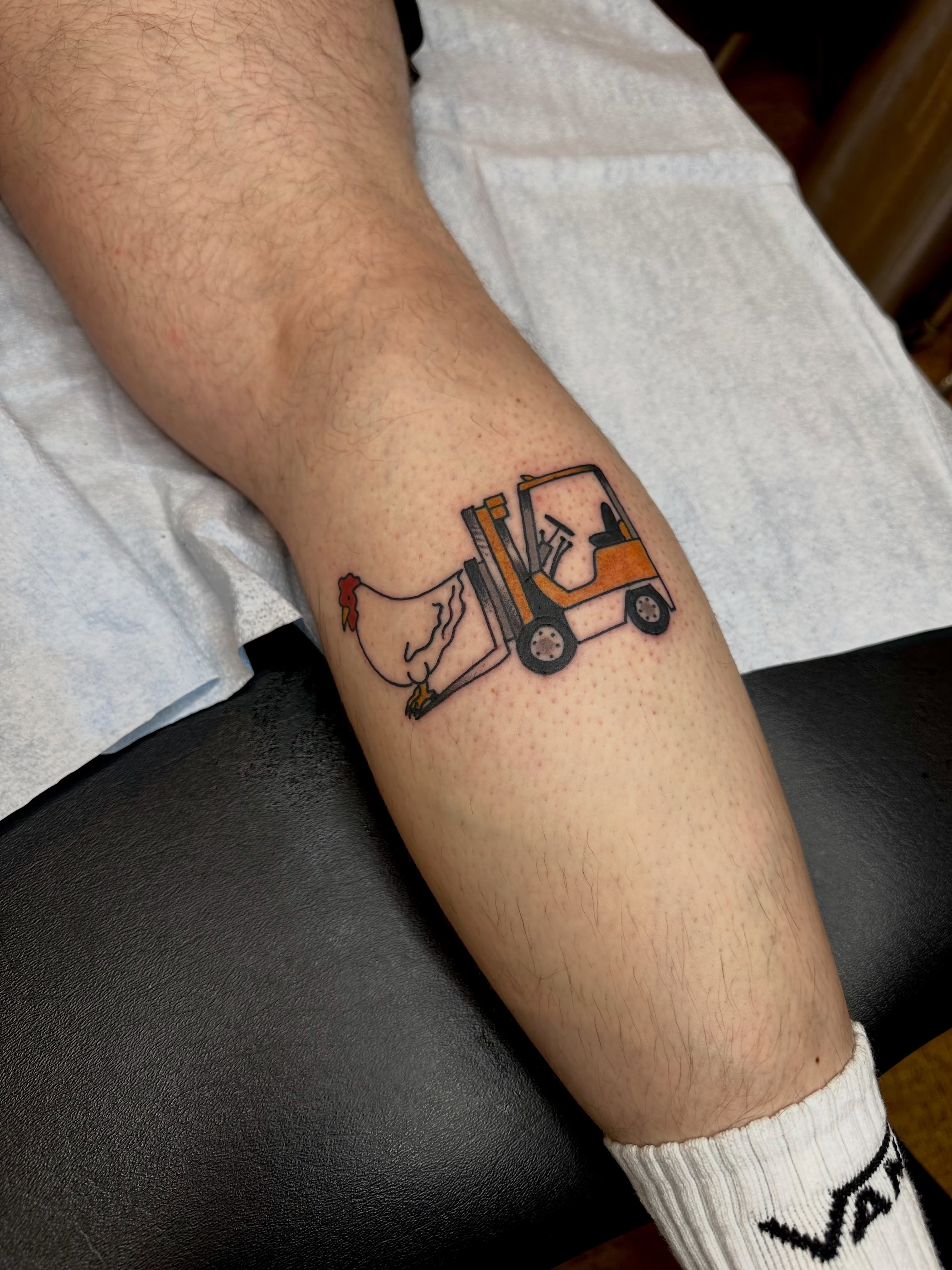 Forklift and chicken dotwork tattoo on the forearm by teddy, Portland, Oregon