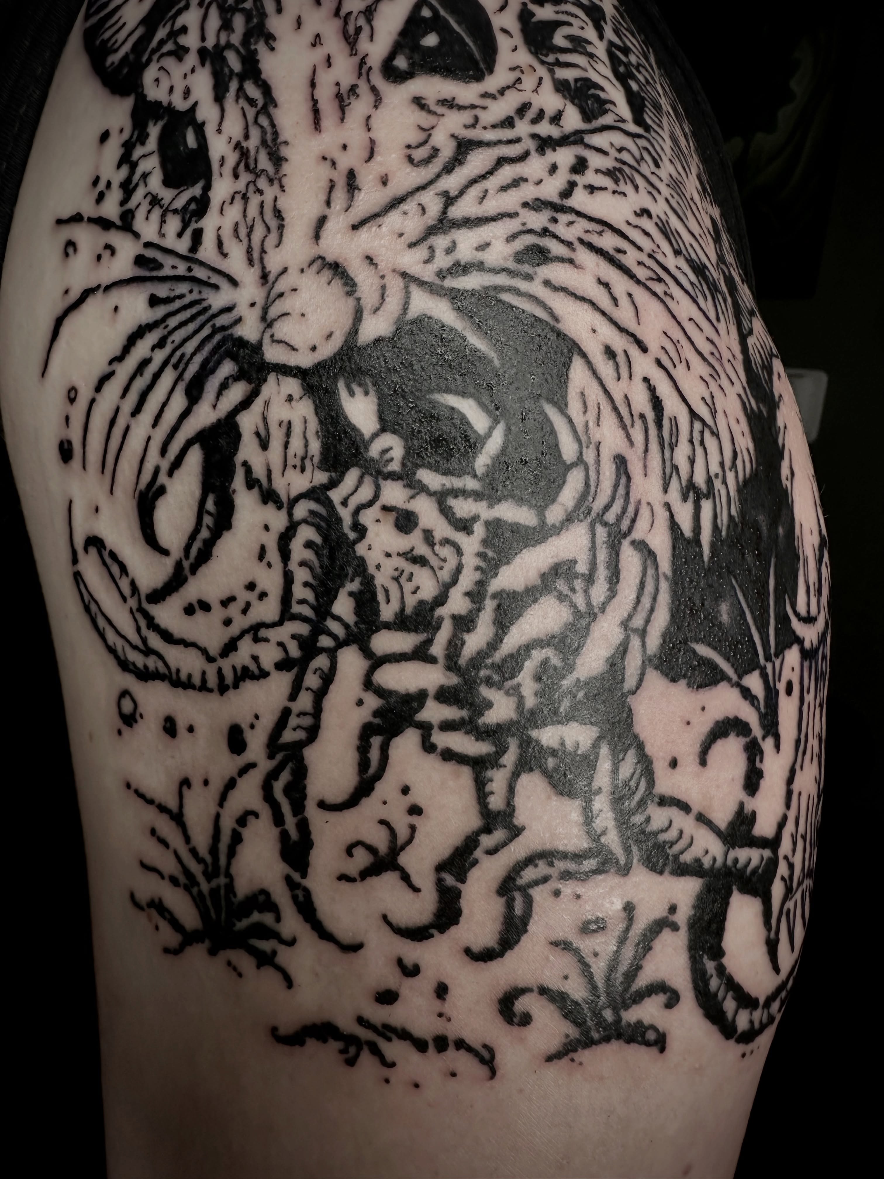 Cat and demon black and grey tattoo on the forearm by Noah Durany