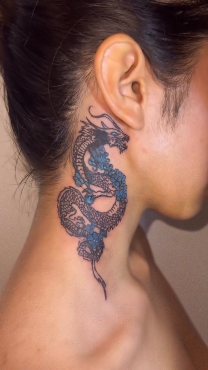 Dragon watercolor tattoo on the neck by Comet