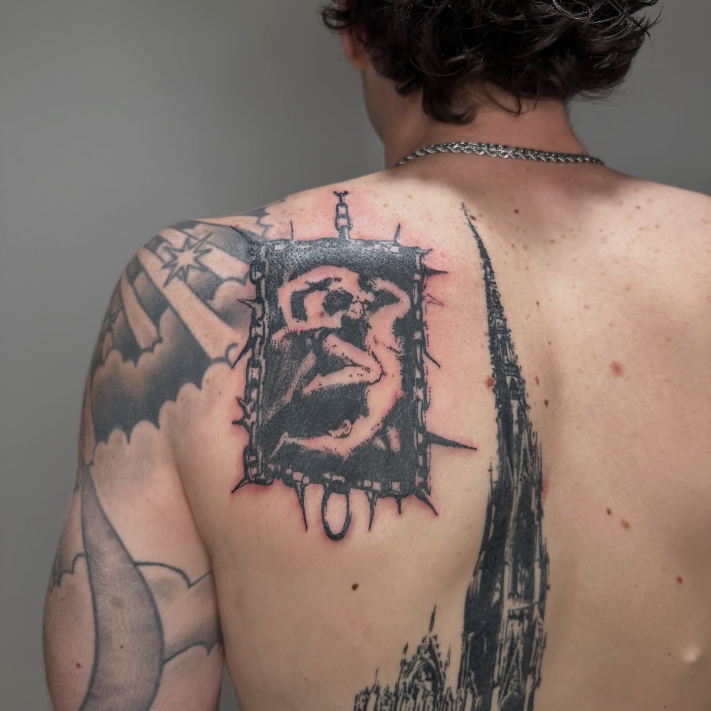 Jail cell with figure black and grey tattoo on the back by πΈππππππ