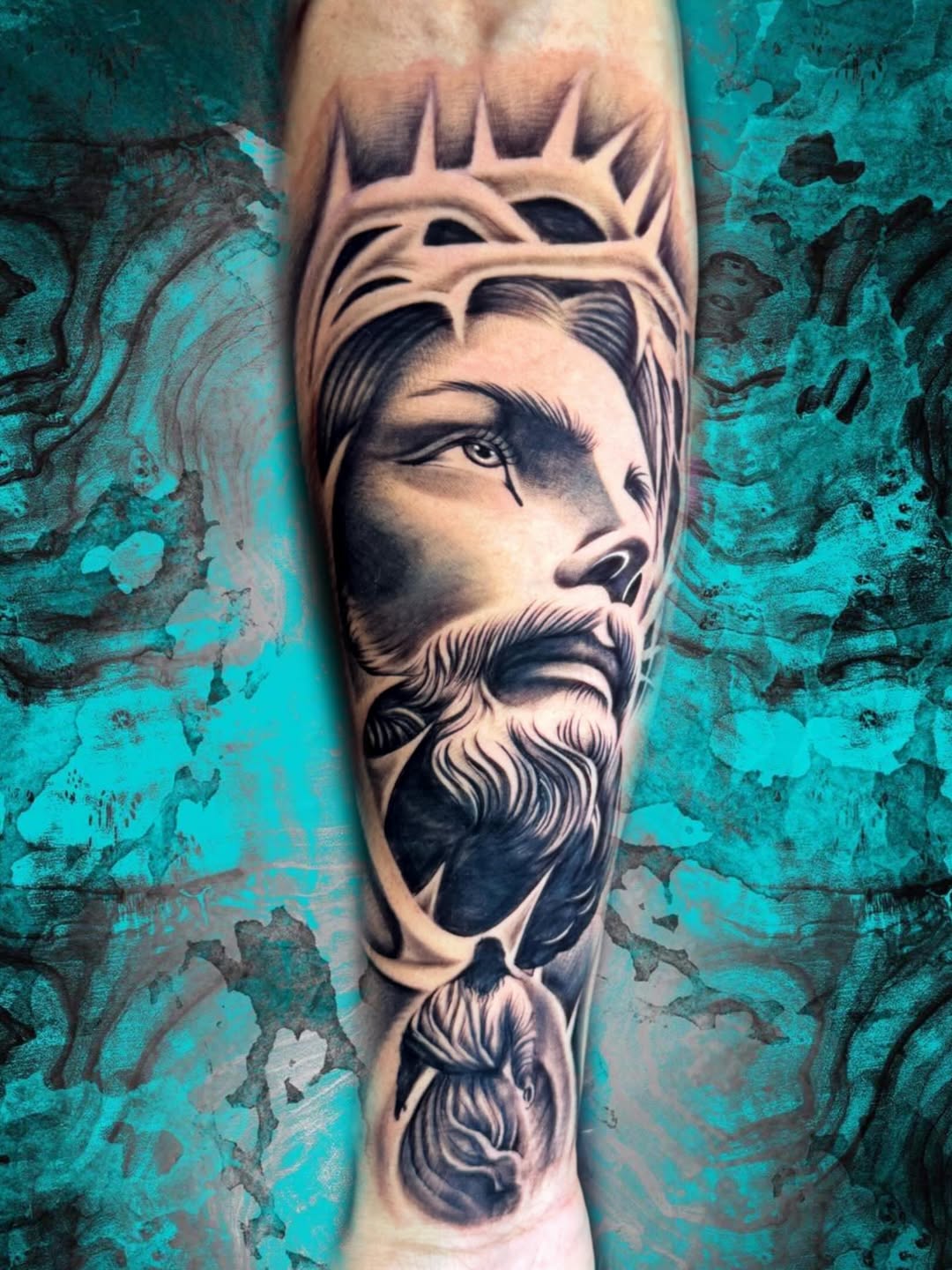 Jesus Christ portrait Chicano tattoo on the forearm by Luis Chauta