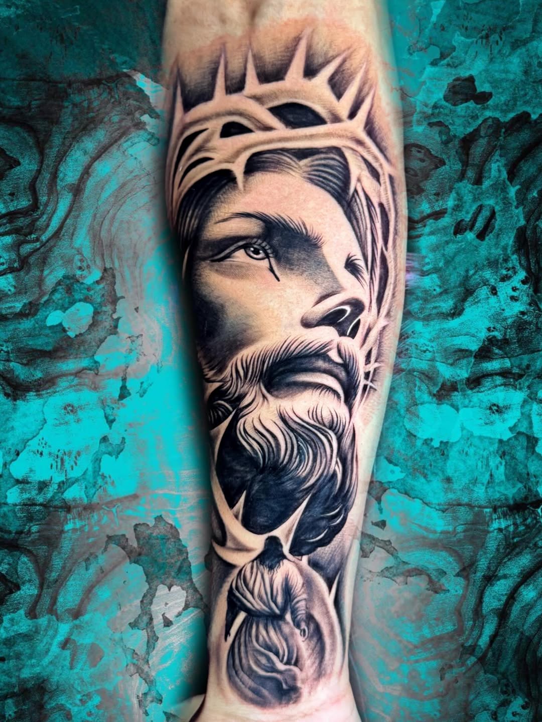 Jesus Christ portrait Chicano tattoo on the forearm by Luis Chauta