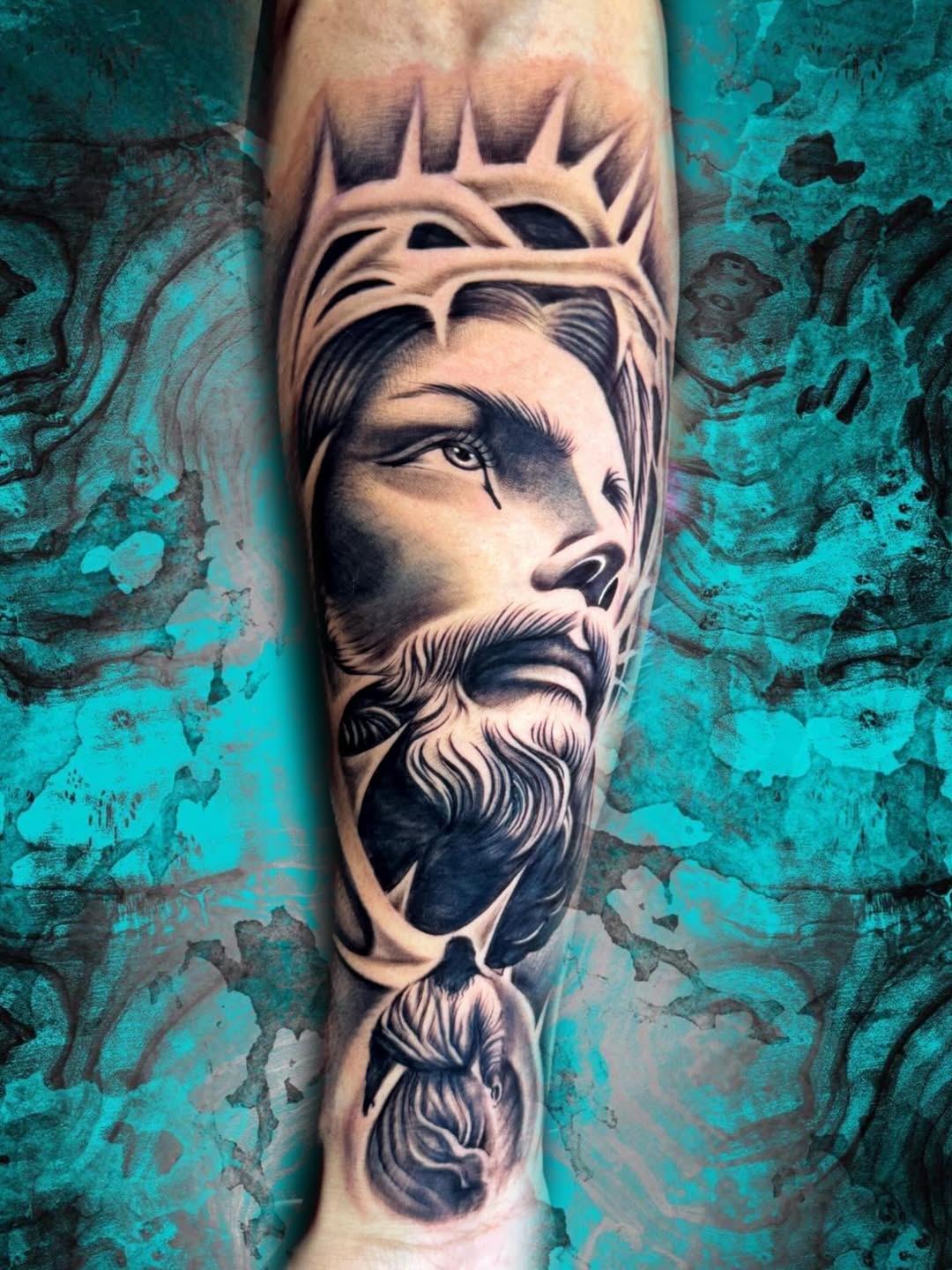 Jesus Christ portrait Chicano tattoo on the forearm by Luis Chauta