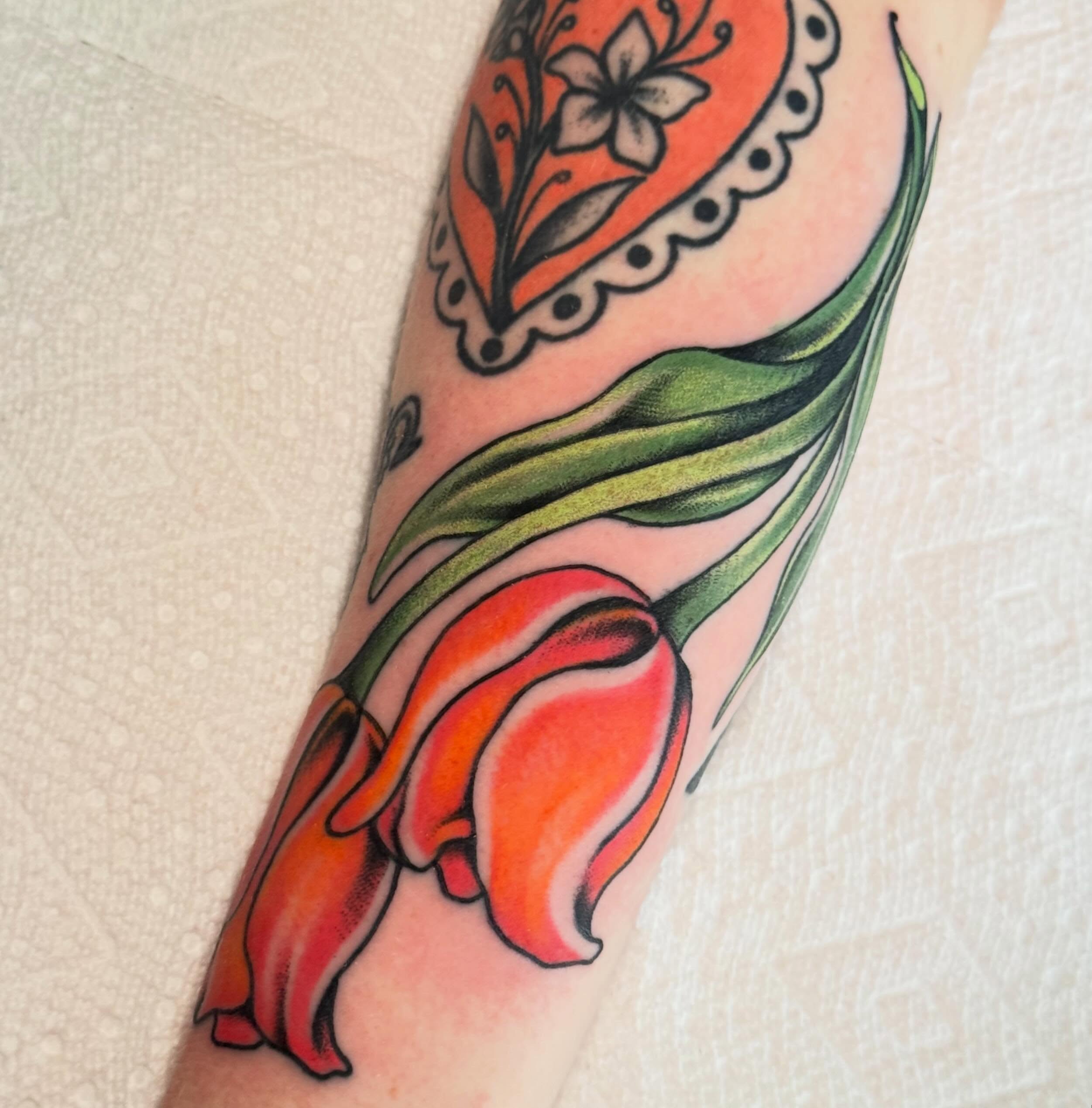 Tulip new school tattoo on the forearm by Painted Peach Tattooer