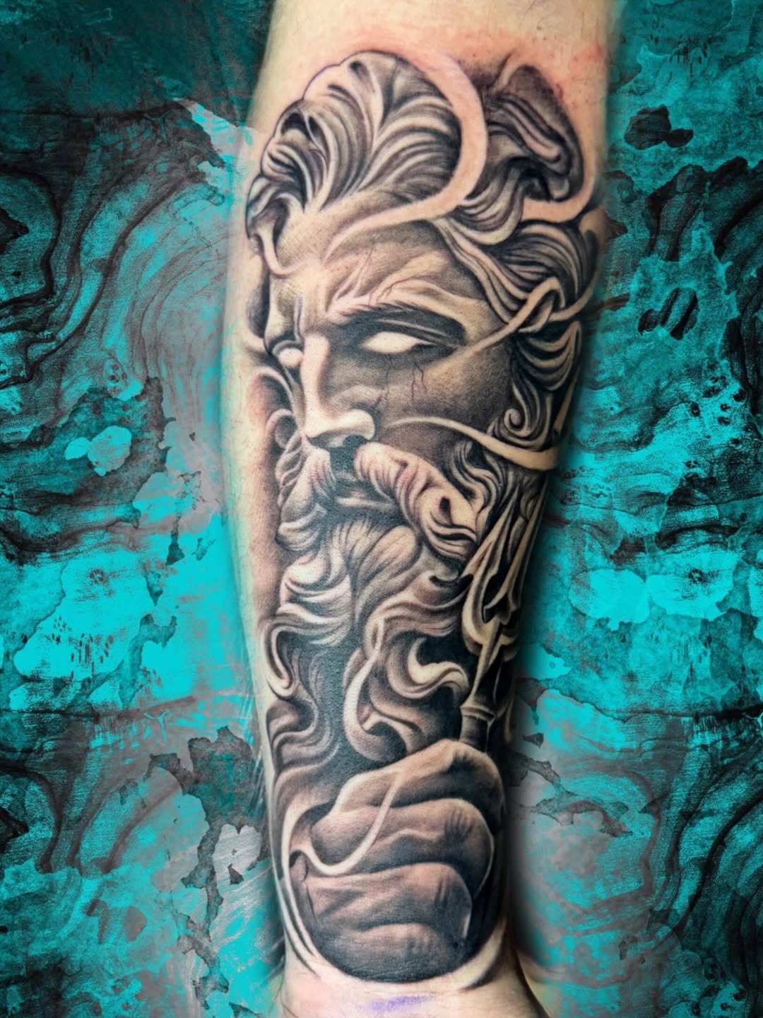 Poseidon surrealism tattoo on the forearm by Luis Chauta