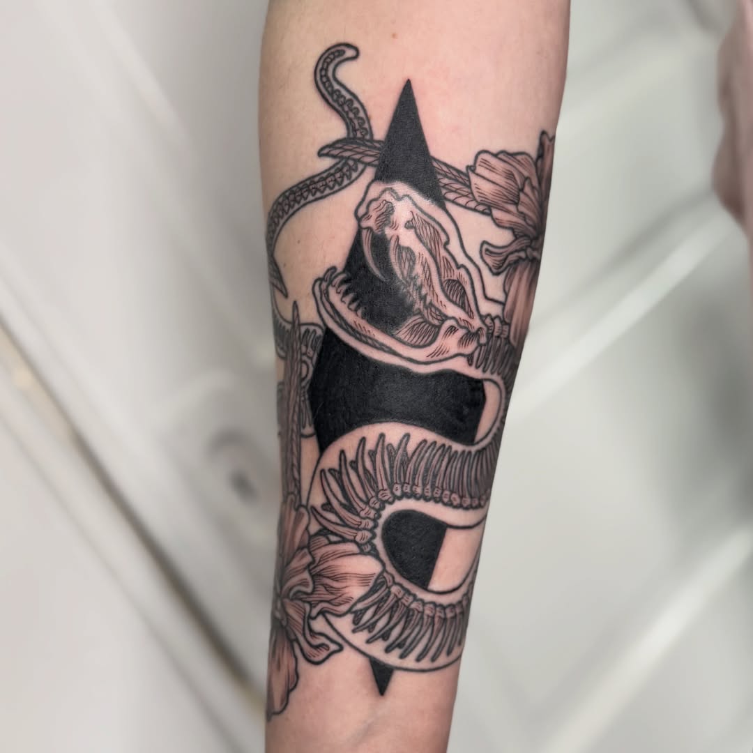 Snake and peony black and grey tattoo on the forearm by Taylor 🍂☕️