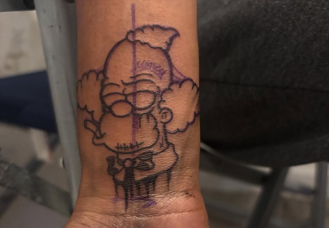 Homer Simpson smoking ignorant tattoo on the forearm by Ink_ Hustle36