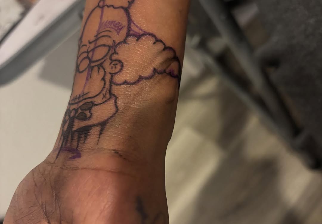 Homer Simpson tattoo on the forearm by Ink_ Hustle36