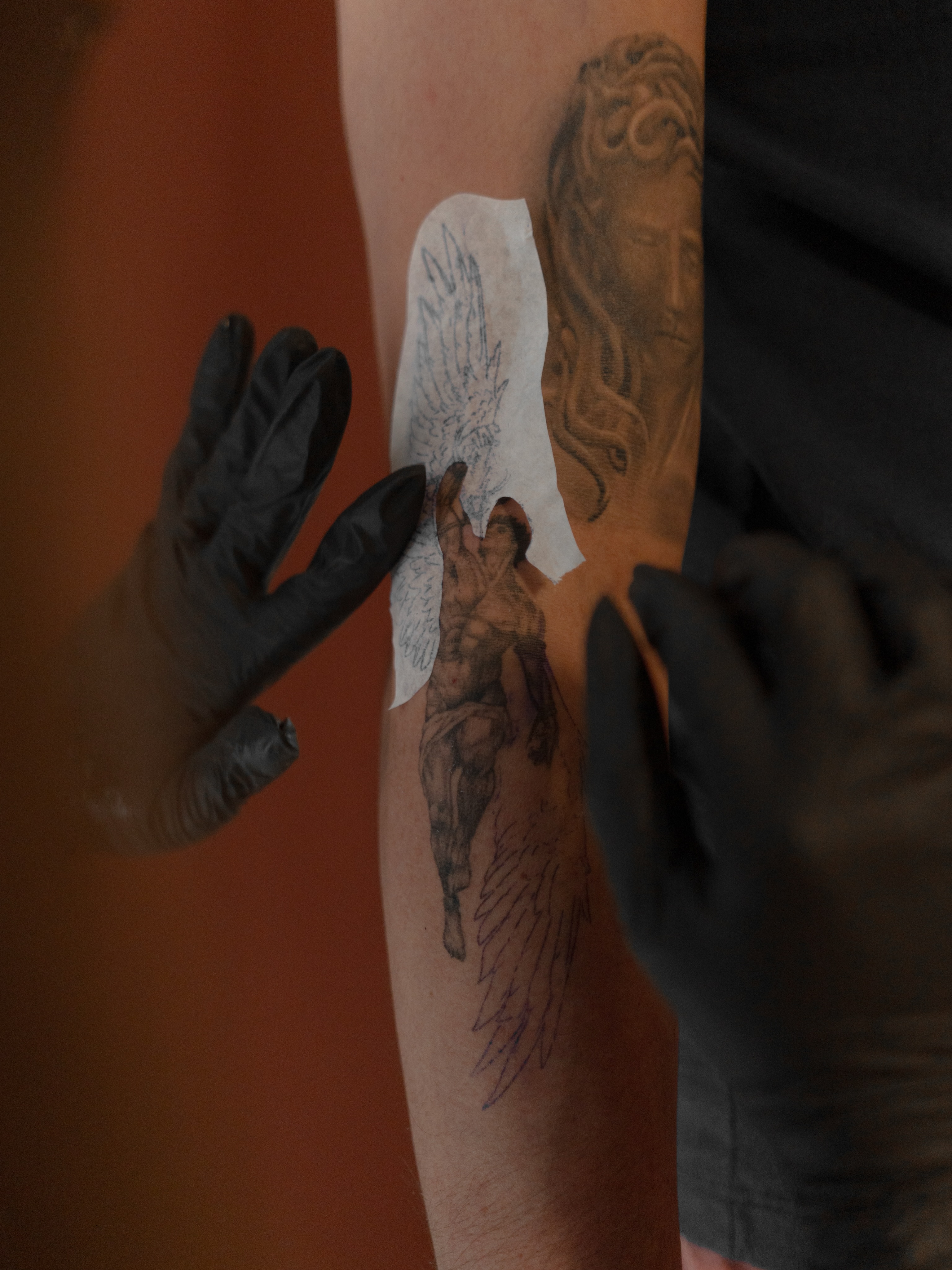 Angelic figure black and grey tattoo on the forearm by Jen- San Antonio tattoo artist