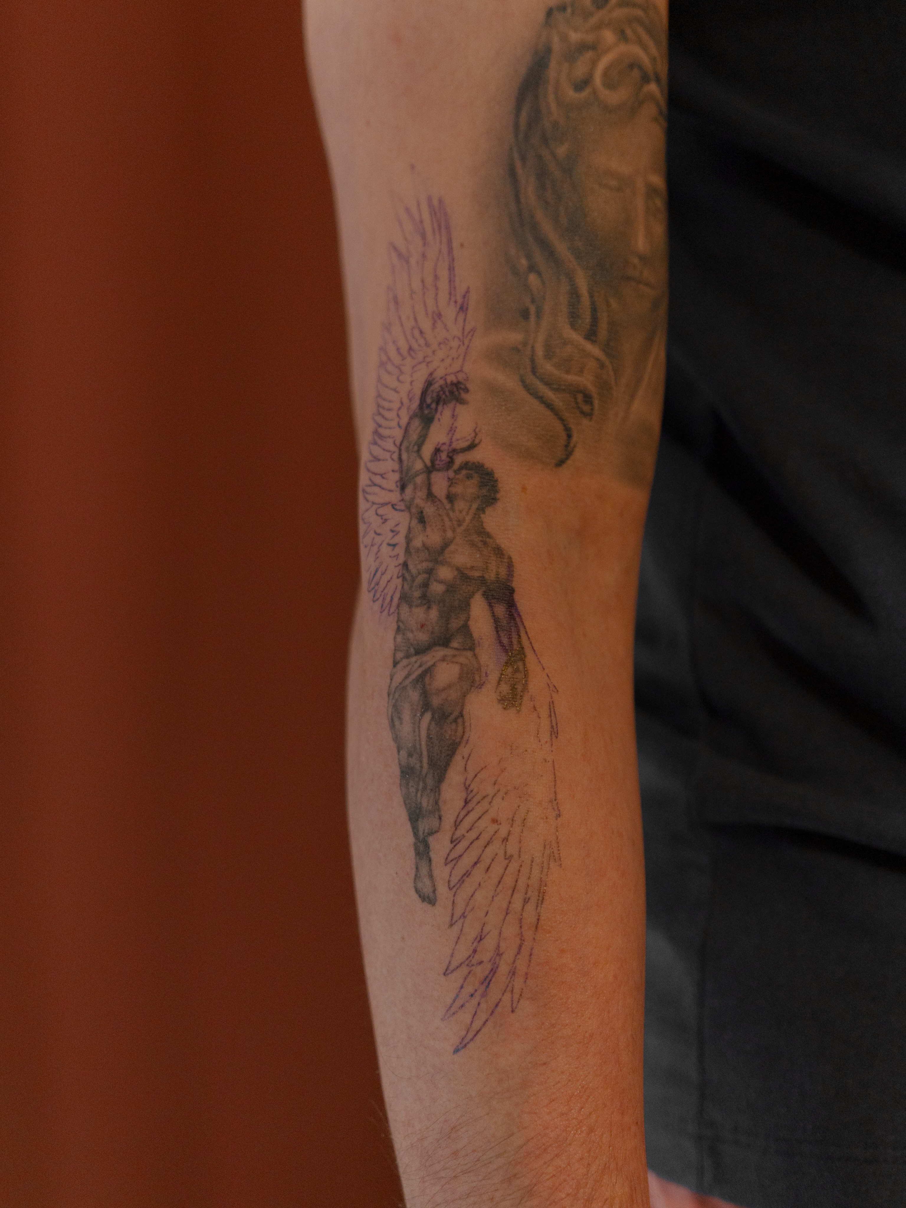 Angelic figure black and grey tattoo on the forearm by Jen- San Antonio tattoo artist