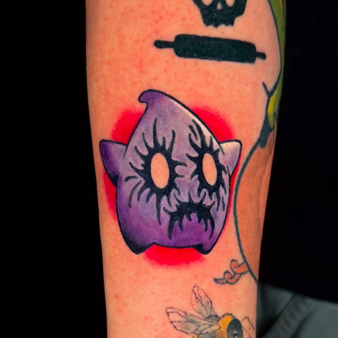 Purple cat American traditional tattoo on the forearm by Trenton Helms