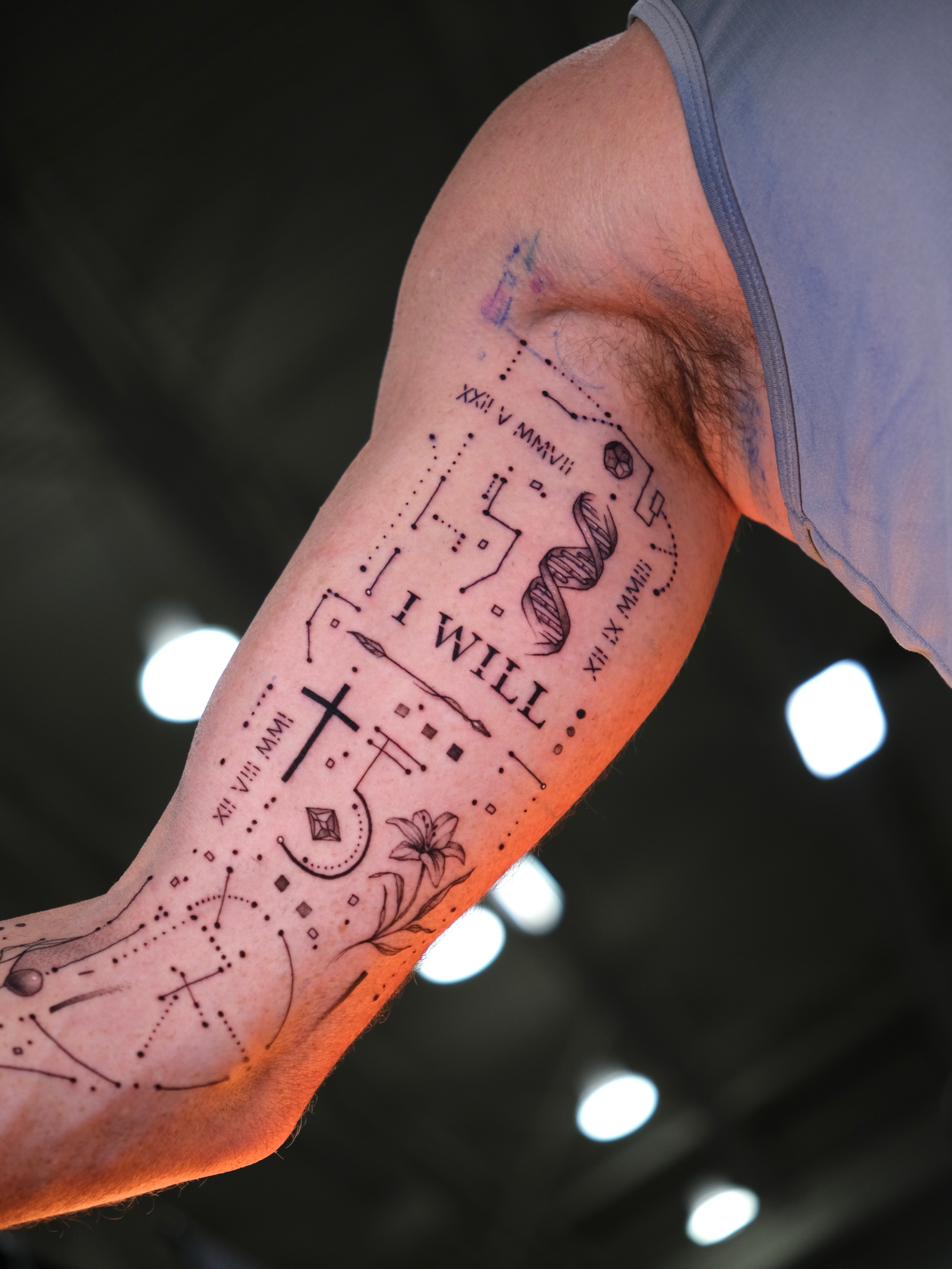 Geometric symbols and text geometric tattoo on the forearm by Tattoo Miami π