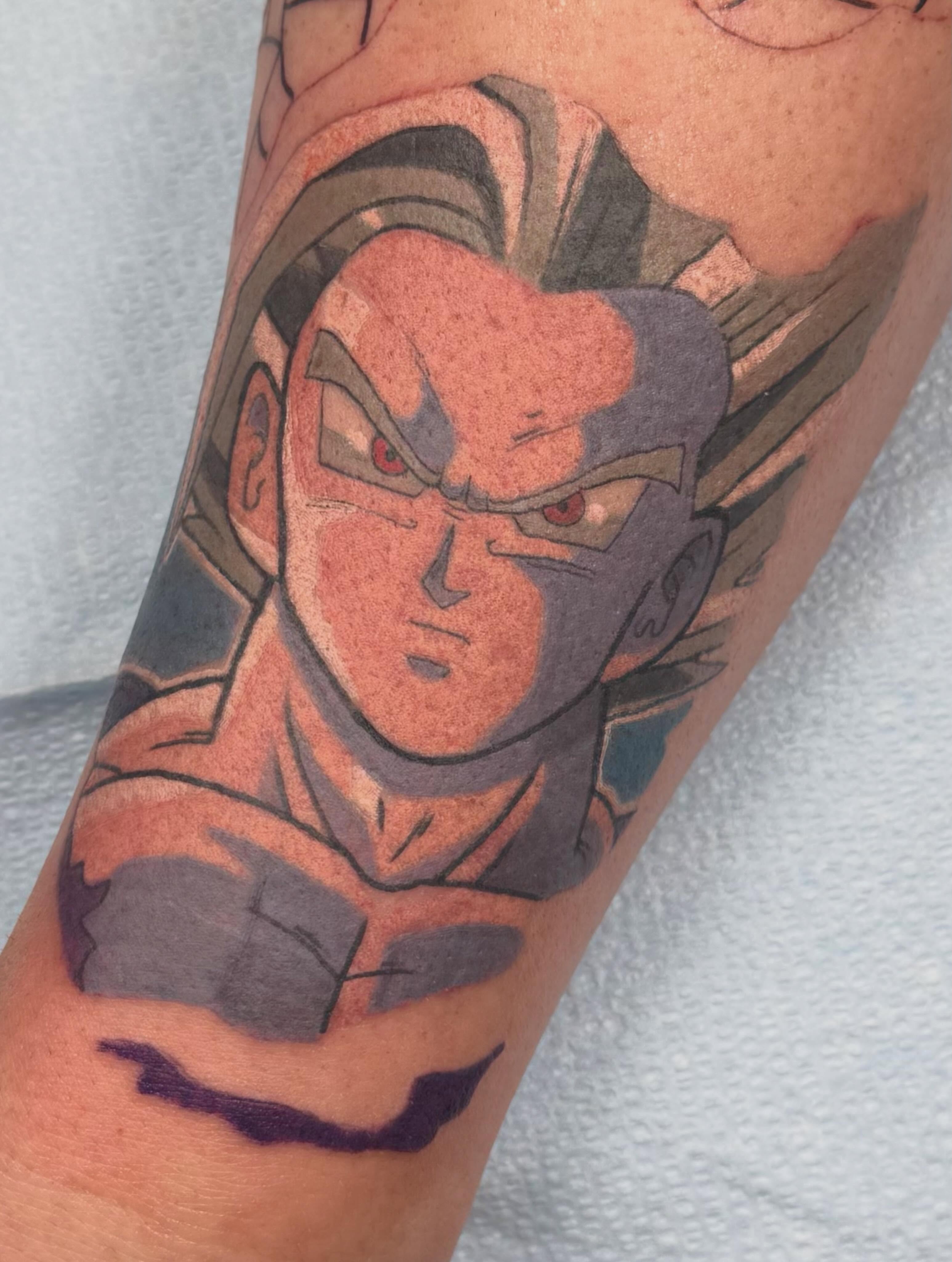 Dragon ball character anime tattoo on the forearm by Mike Corn