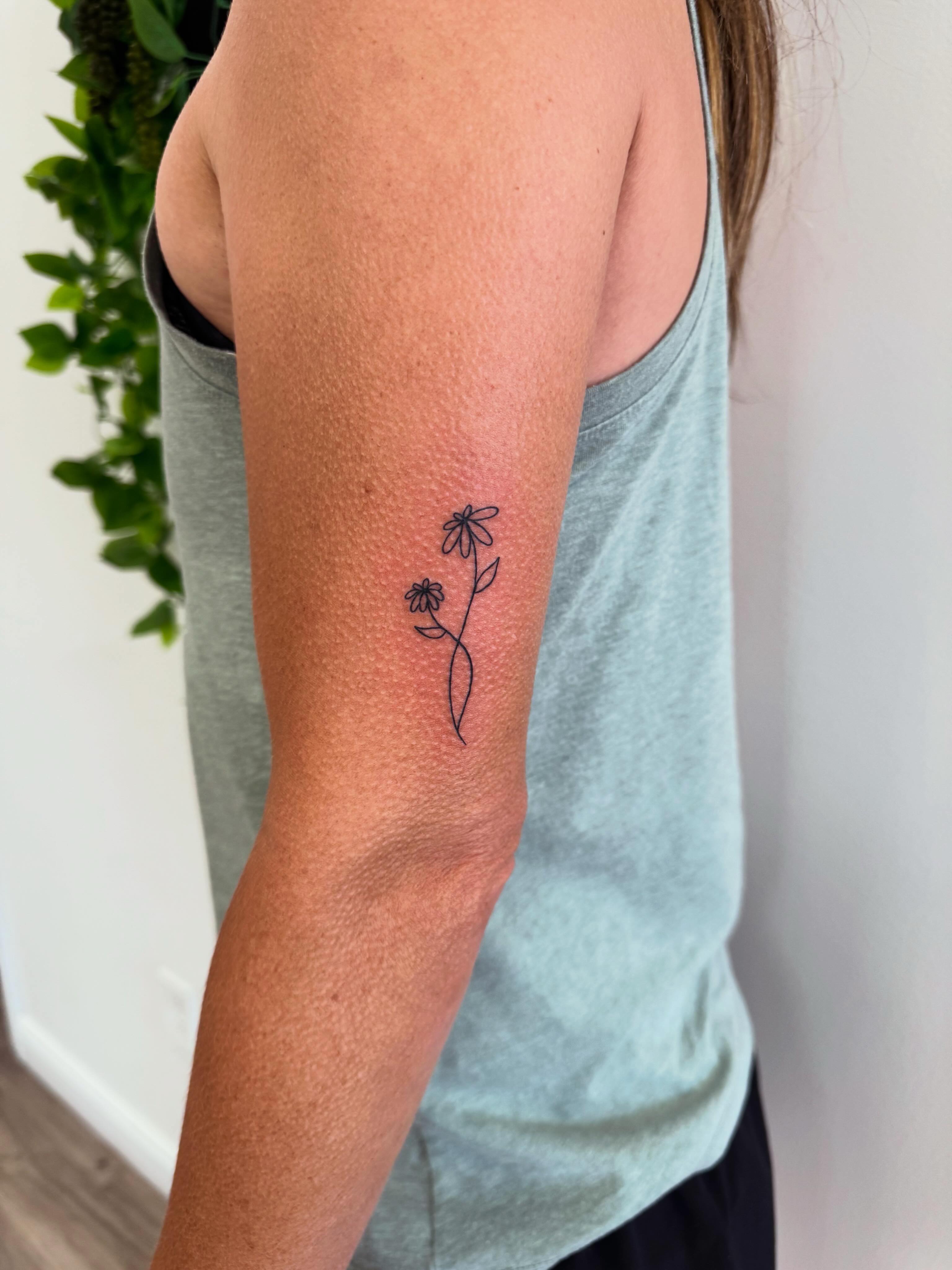 Daisy fine line tattoo on the forearm by Angela Nery, South Jordan, Utah