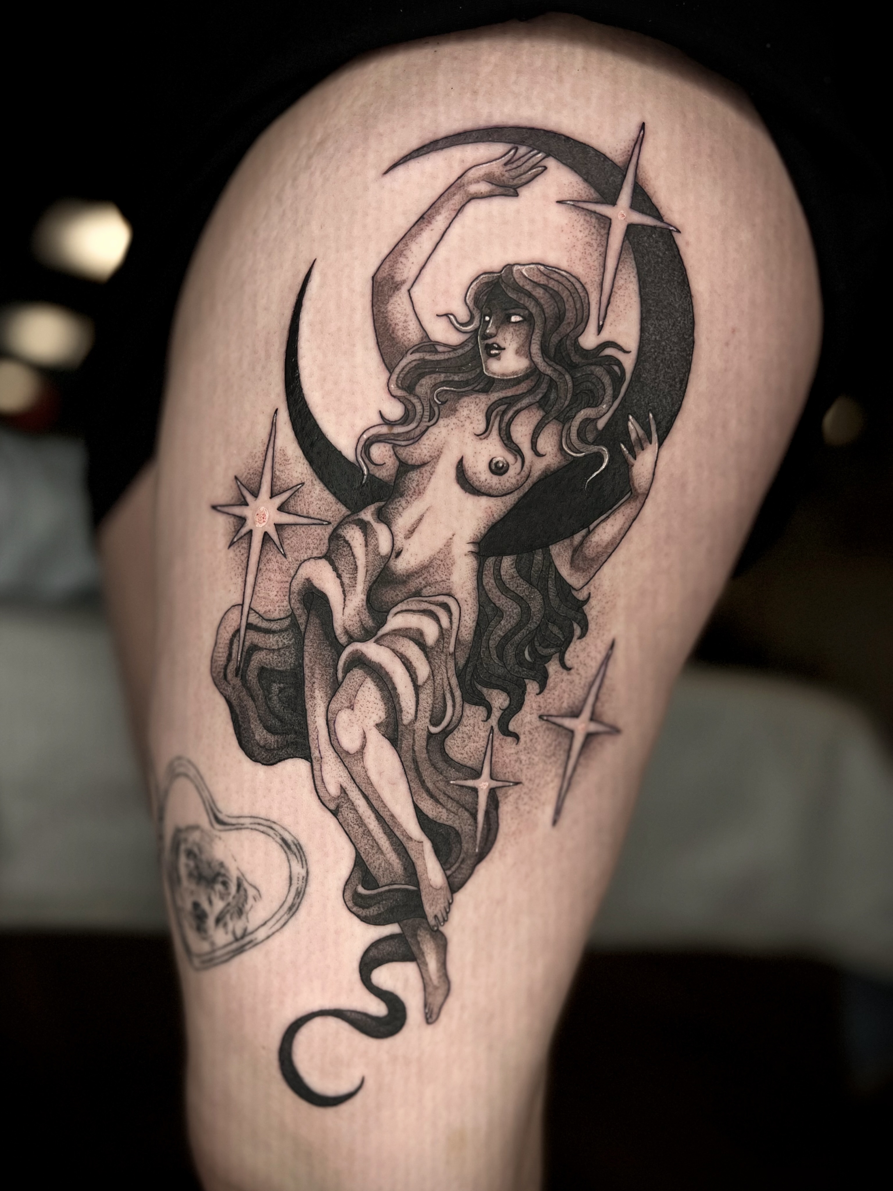 Nude woman and stars dotwork tattoo on the thigh by Kaysee Shuster