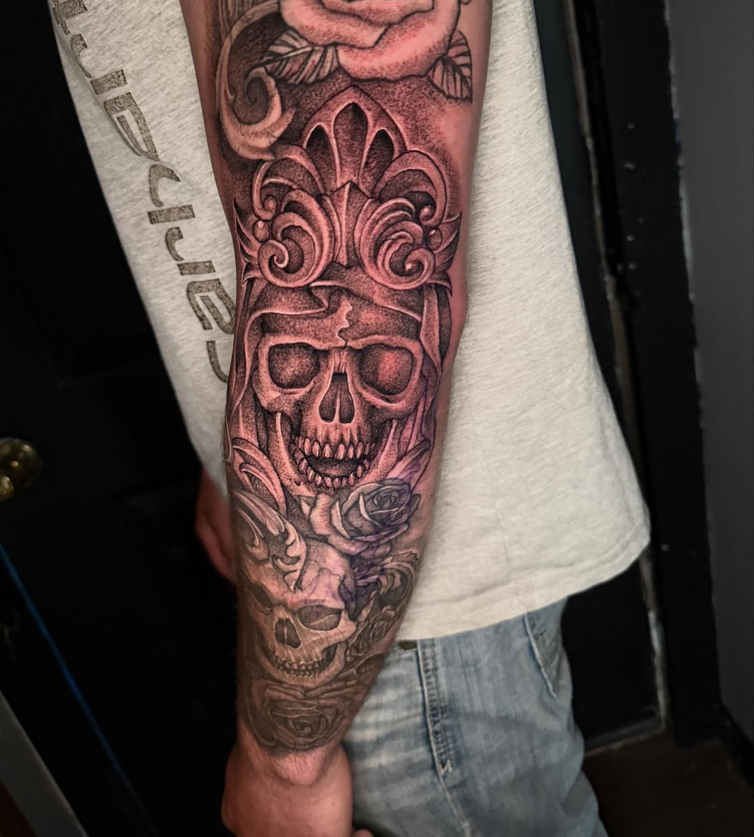 Skull with ornate crown realism tattoo on the forearm by Alex Wheelock