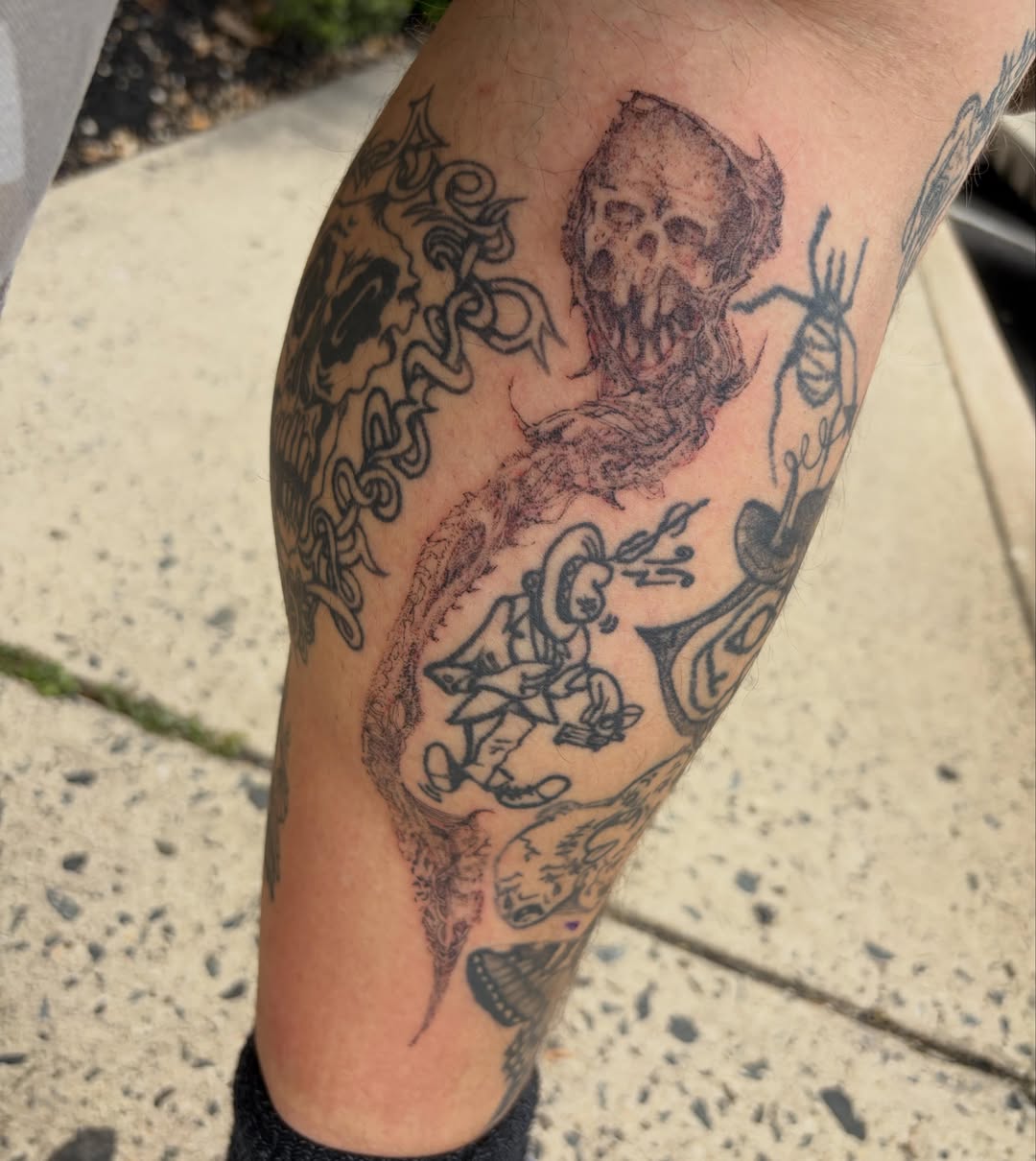 Bearded man with skull American traditional tattoo on the forearm by Crawlspacecadet