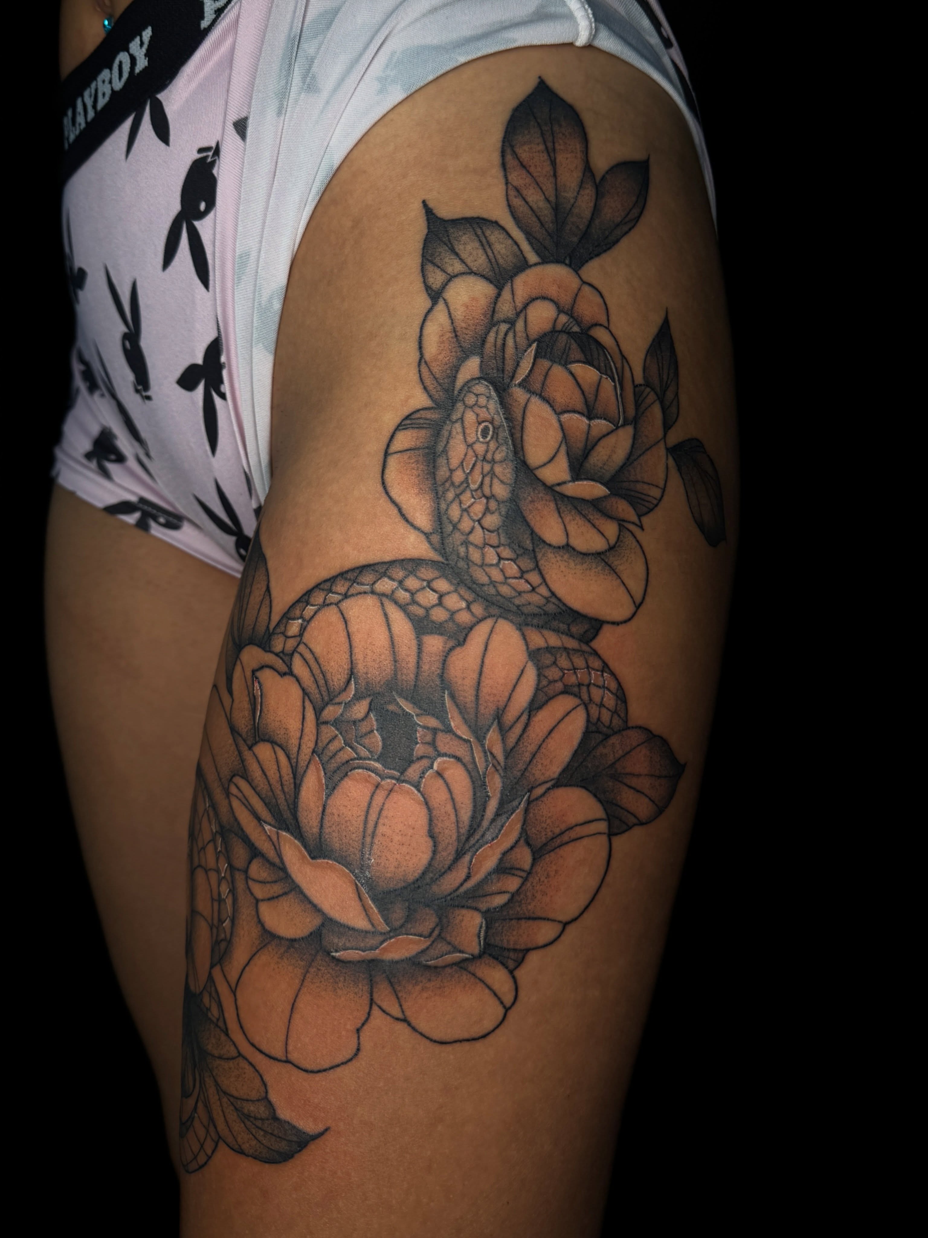 Snake and peony realism tattoo on the upper arm by ✧˖°. Jordan