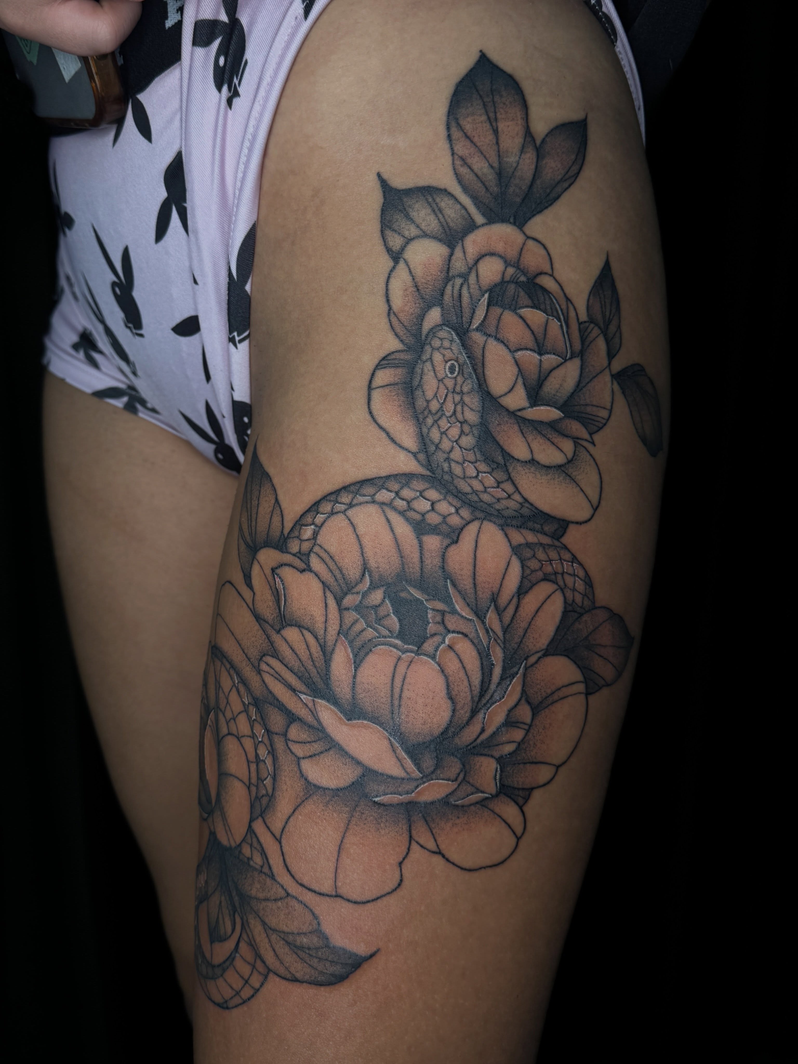 Snake and peony black and grey tattoo on the thigh by ✧˖°. Jordan