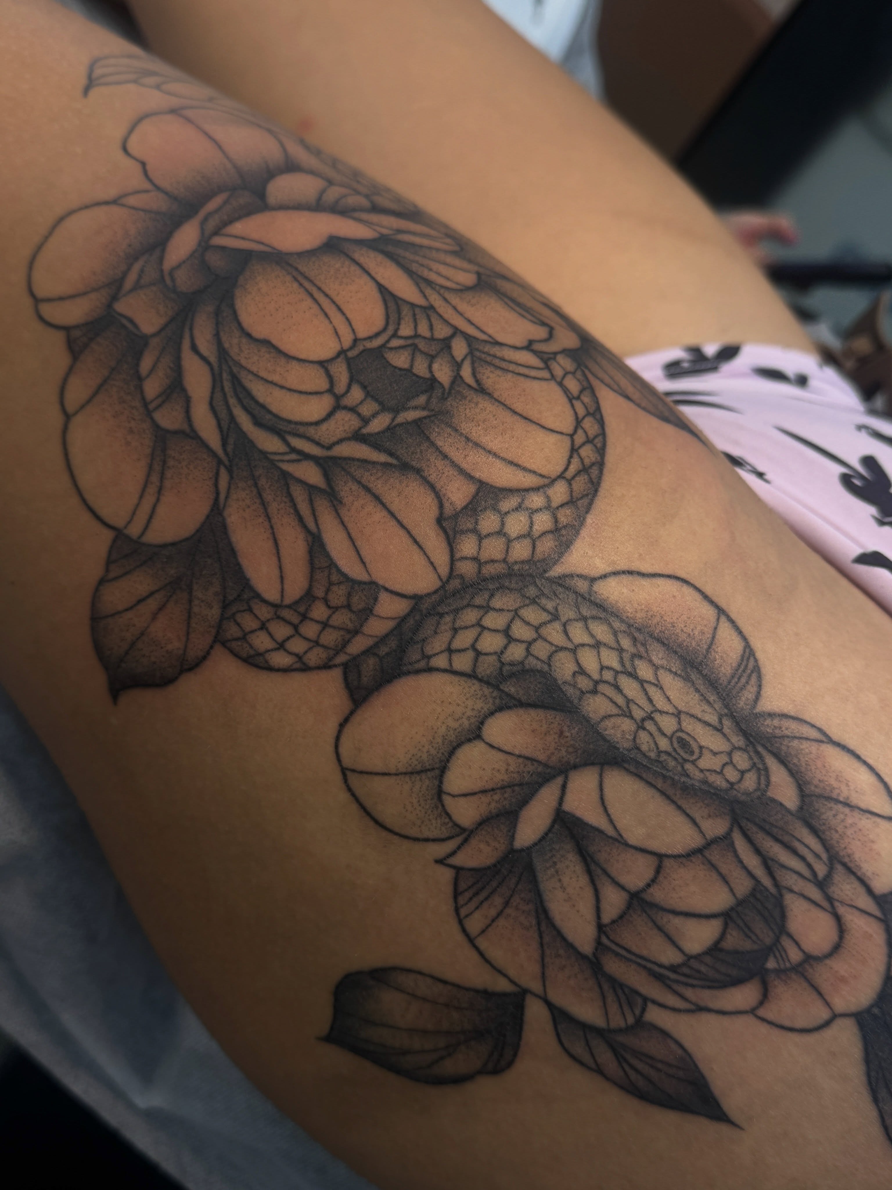 Snake and peony dotwork tattoo on the thigh by ✧˖°. Jordan