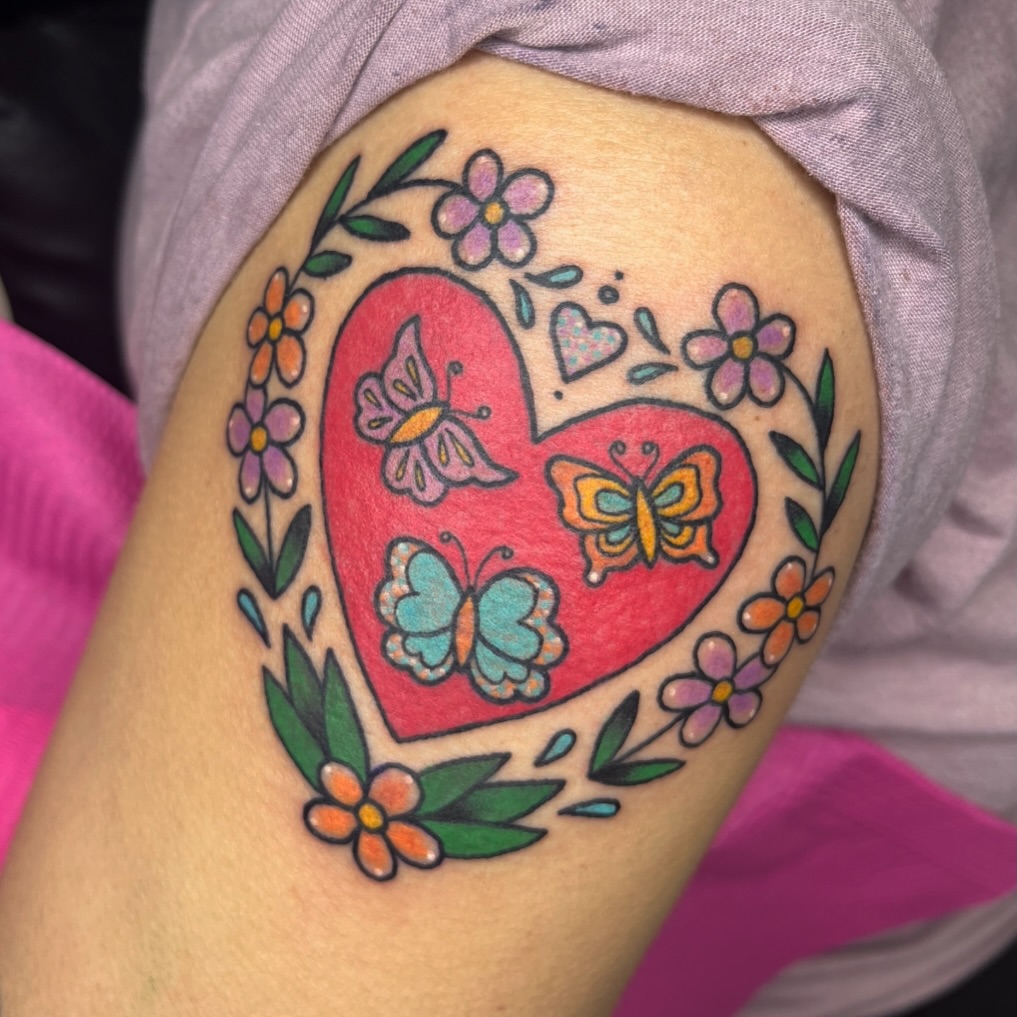 Heart with butterflies American traditional tattoo on the shoulder by Cincinnati Tattoo Artist, Cincinnati