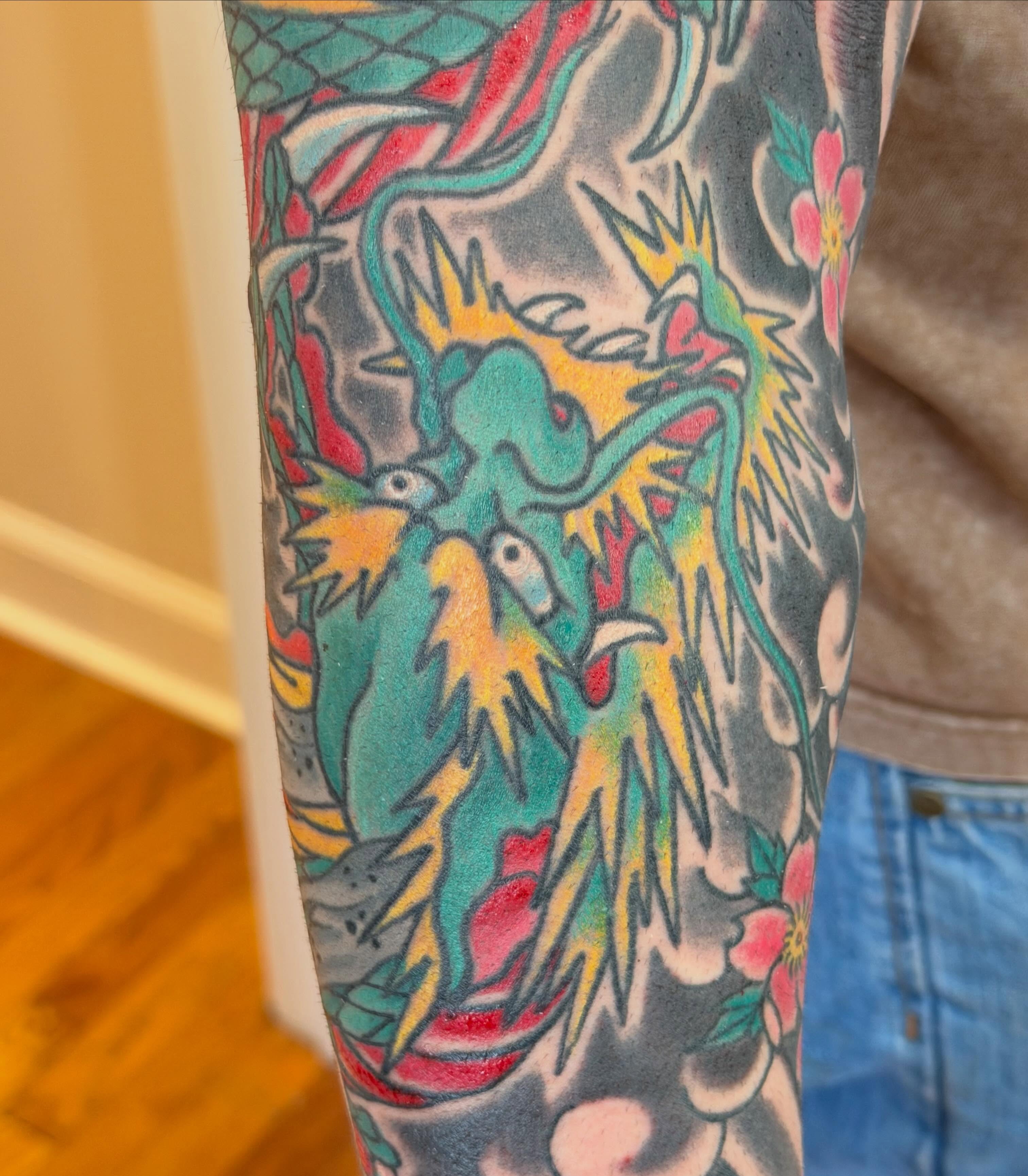 Phoenix American traditional tattoo on the forearm by Laura Saadati Kepper