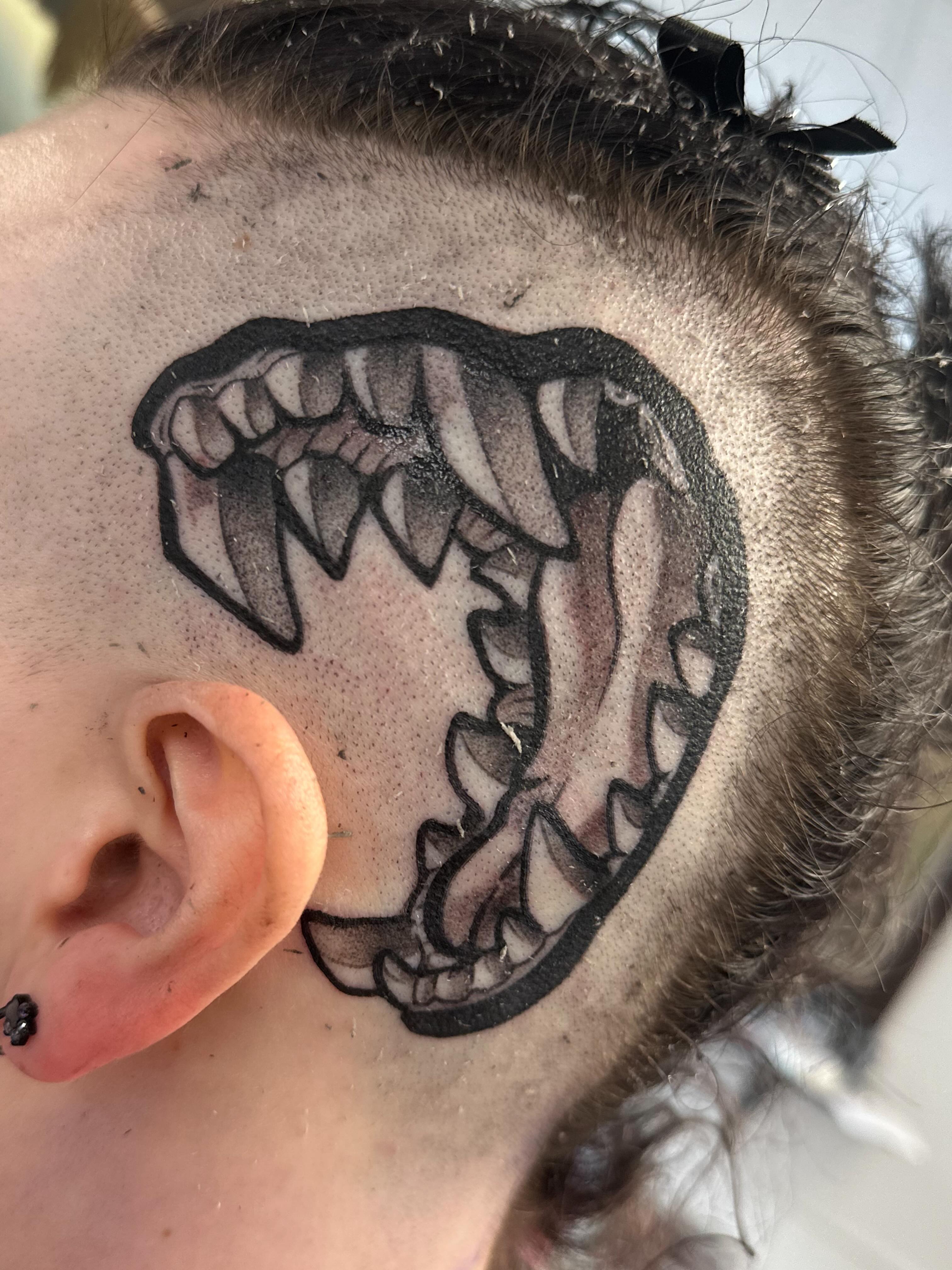 Jagged mouth black and grey tattoo on the neck by Dana Smithson-Taylor ๐ณ๏ธโ๐