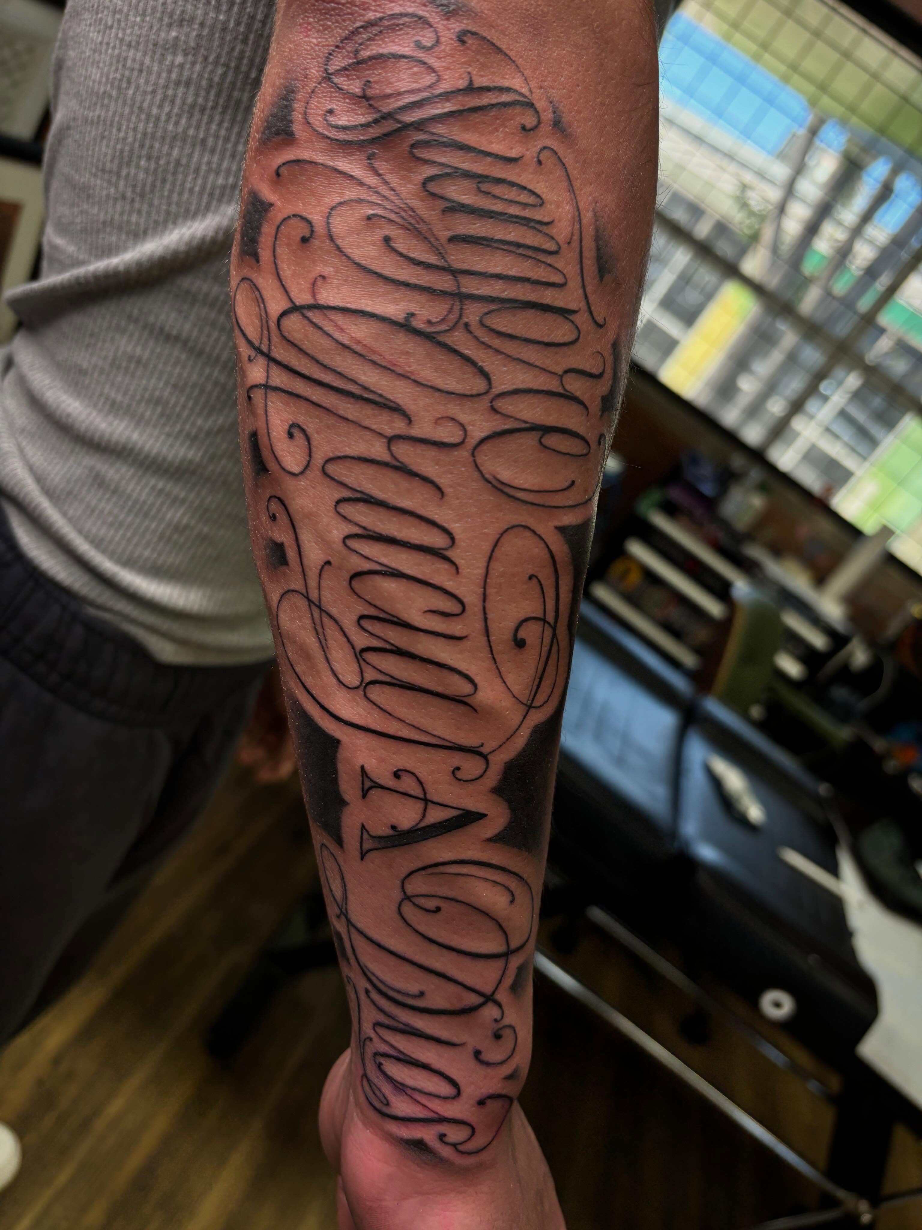 Script lettering lettering script tattoo on the forearm by Jay
