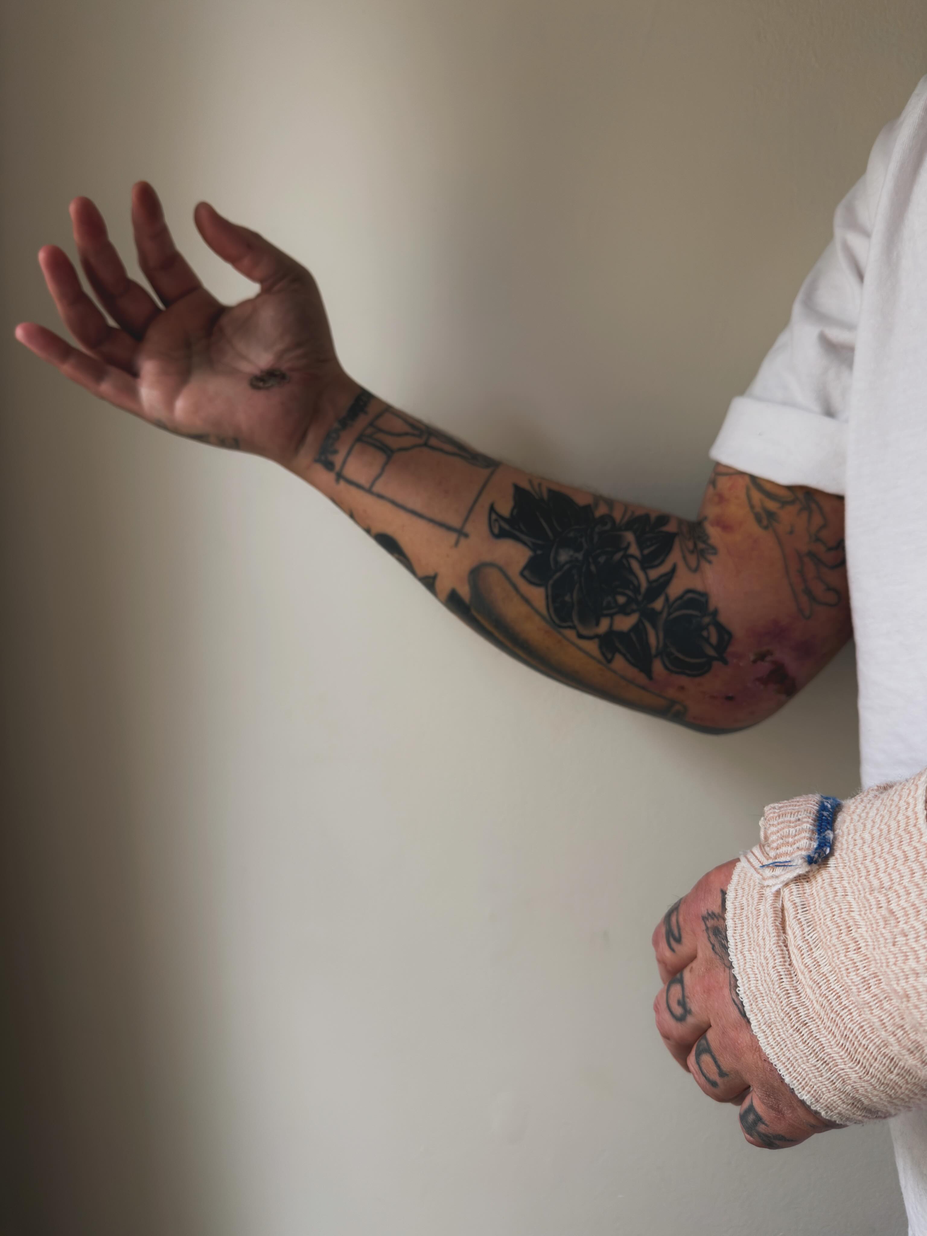 Floral design black and grey tattoo on the forearm by Trav, Bayville, New Jersey