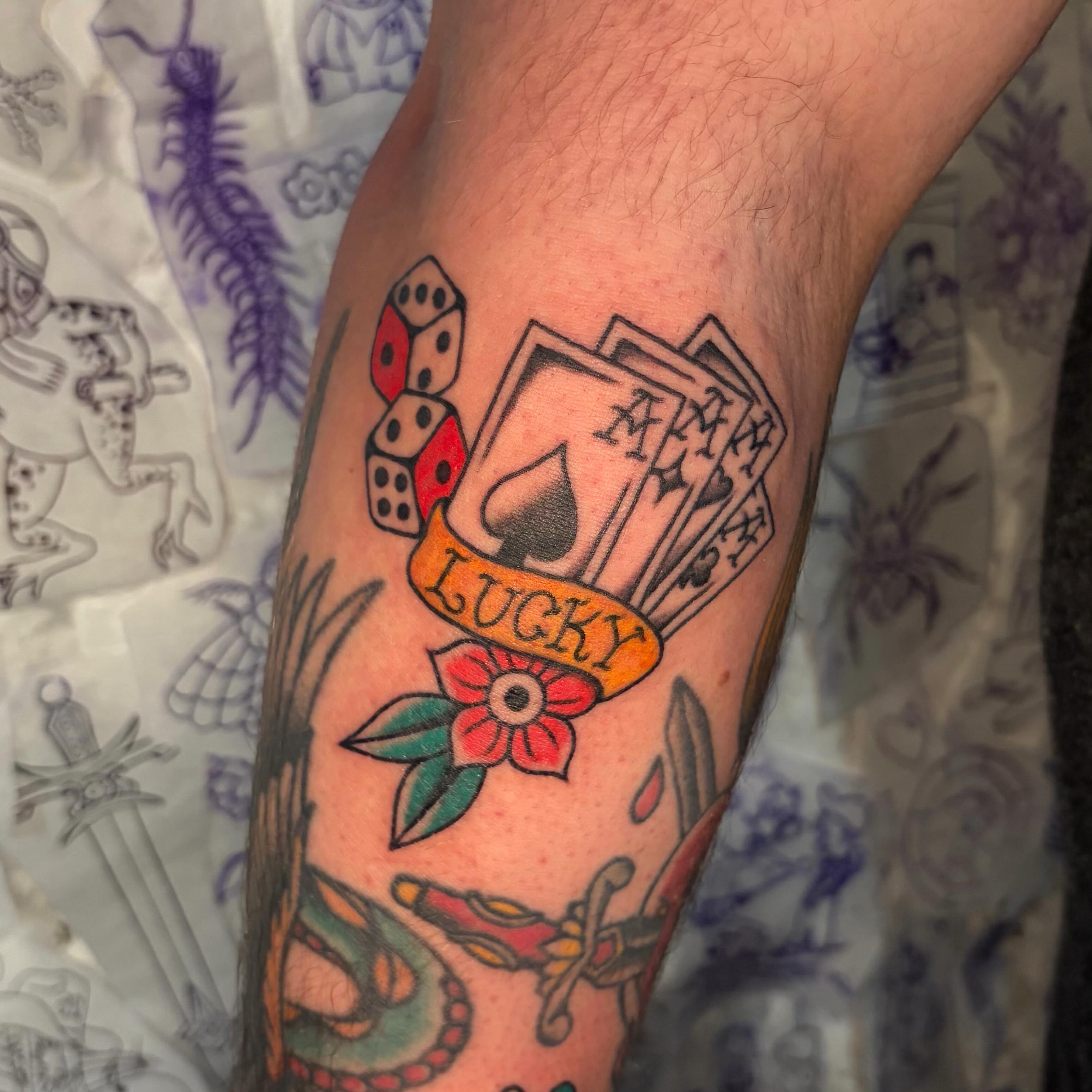 Playing cards and dice American traditional tattoo on the forearm by Danelle ✶ Nashville Tattooer