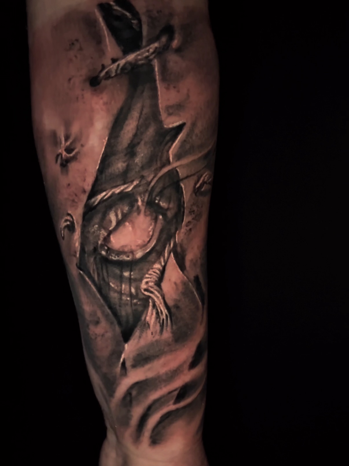 Demon dark realism tattoo on the forearm by C.J. Rued