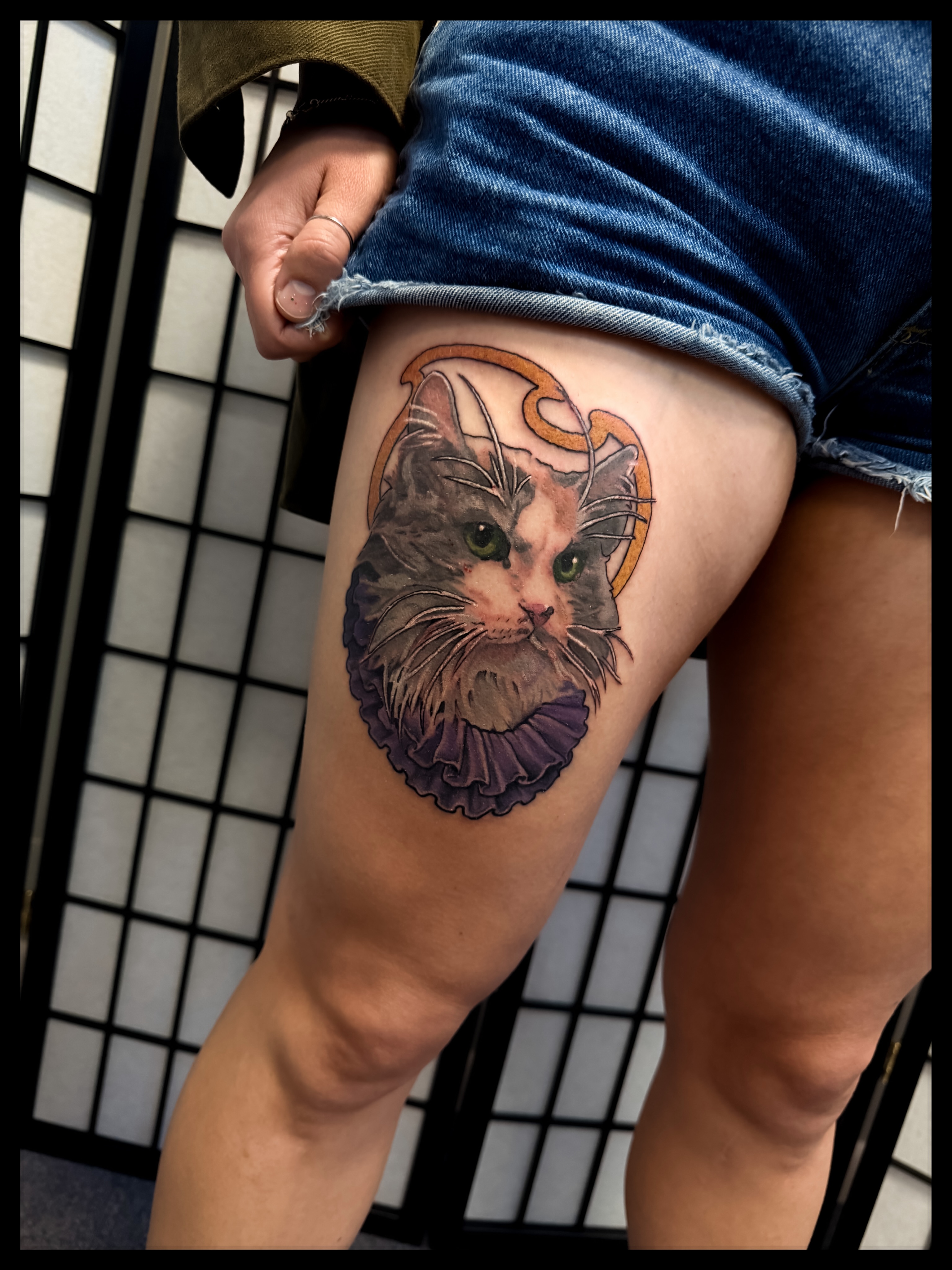 Cat realism tattoo on the thigh by Noah Morris