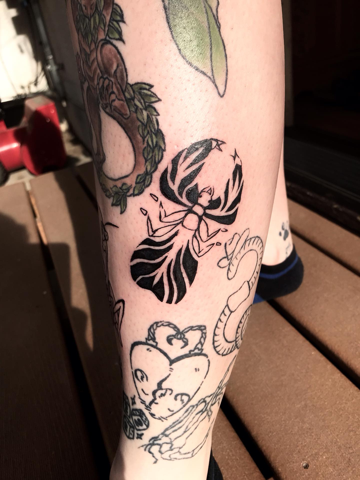 Butterfly black and grey tattoo on the forearm by Karson