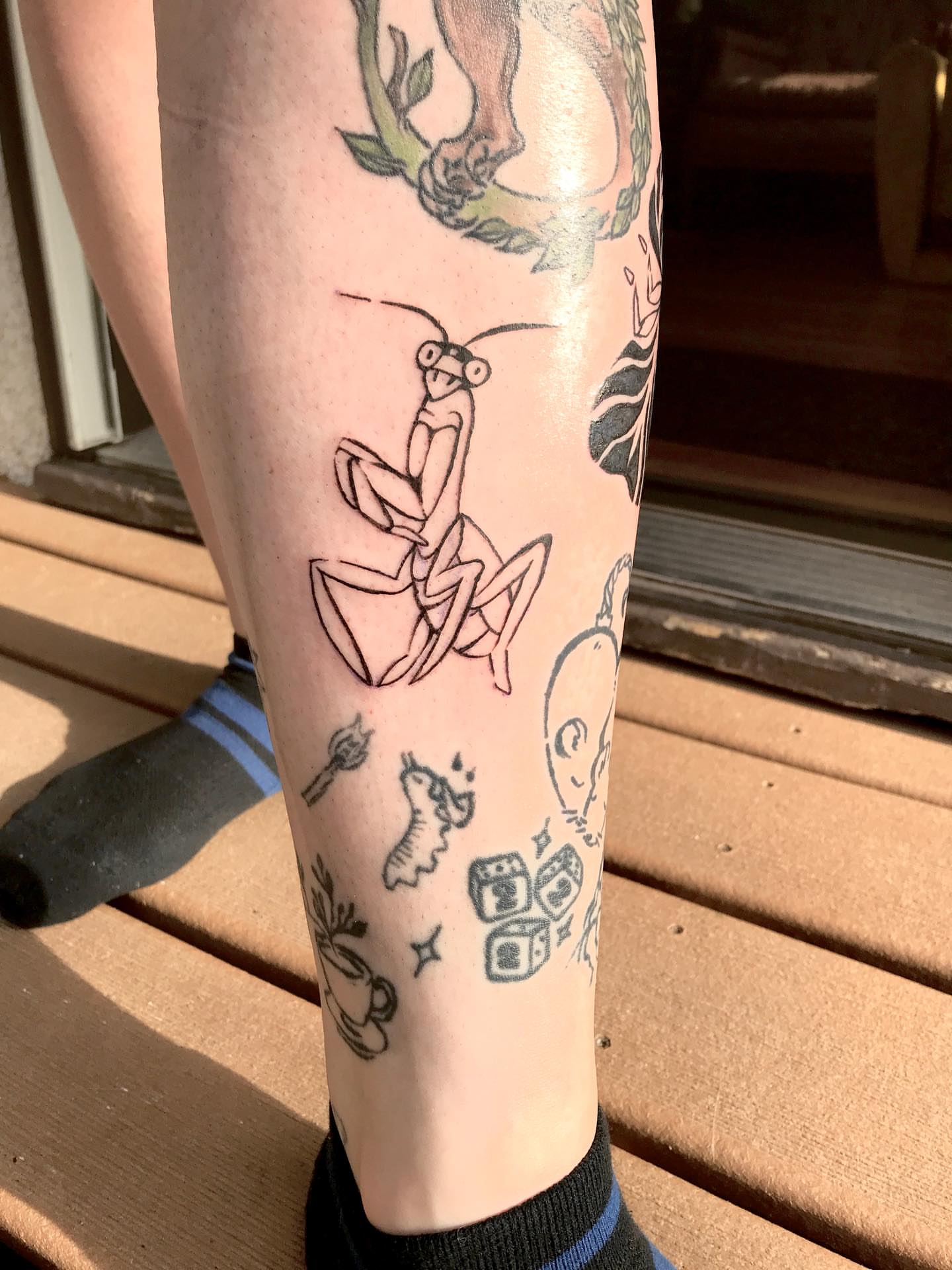 Praying mantis geometric tattoo on the forearm by Karson