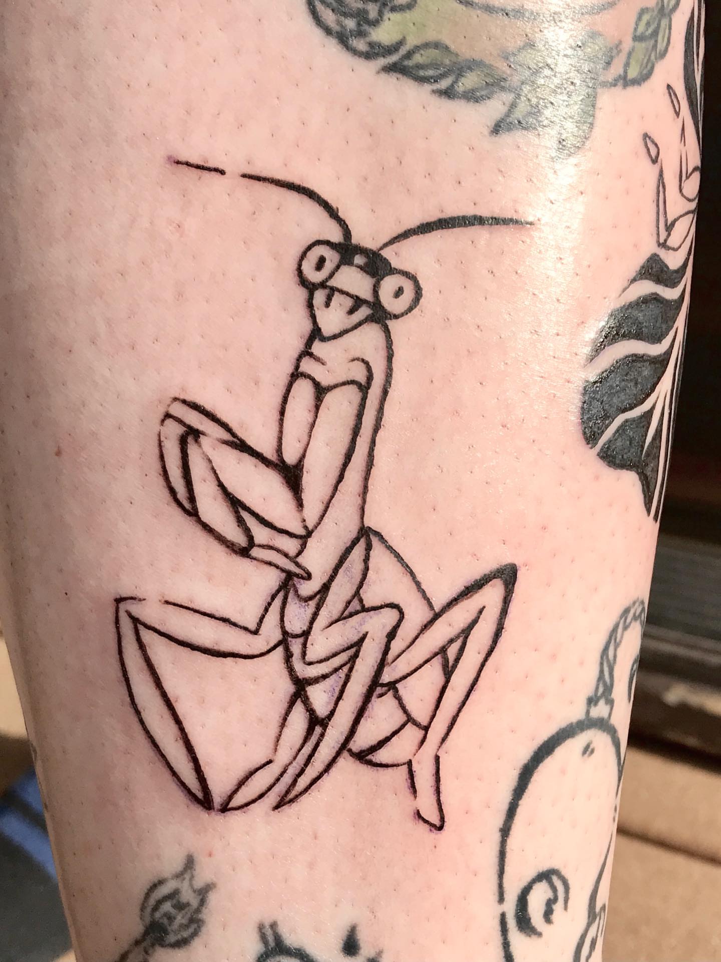 Praying mantis geometric tattoo on the forearm by Karson