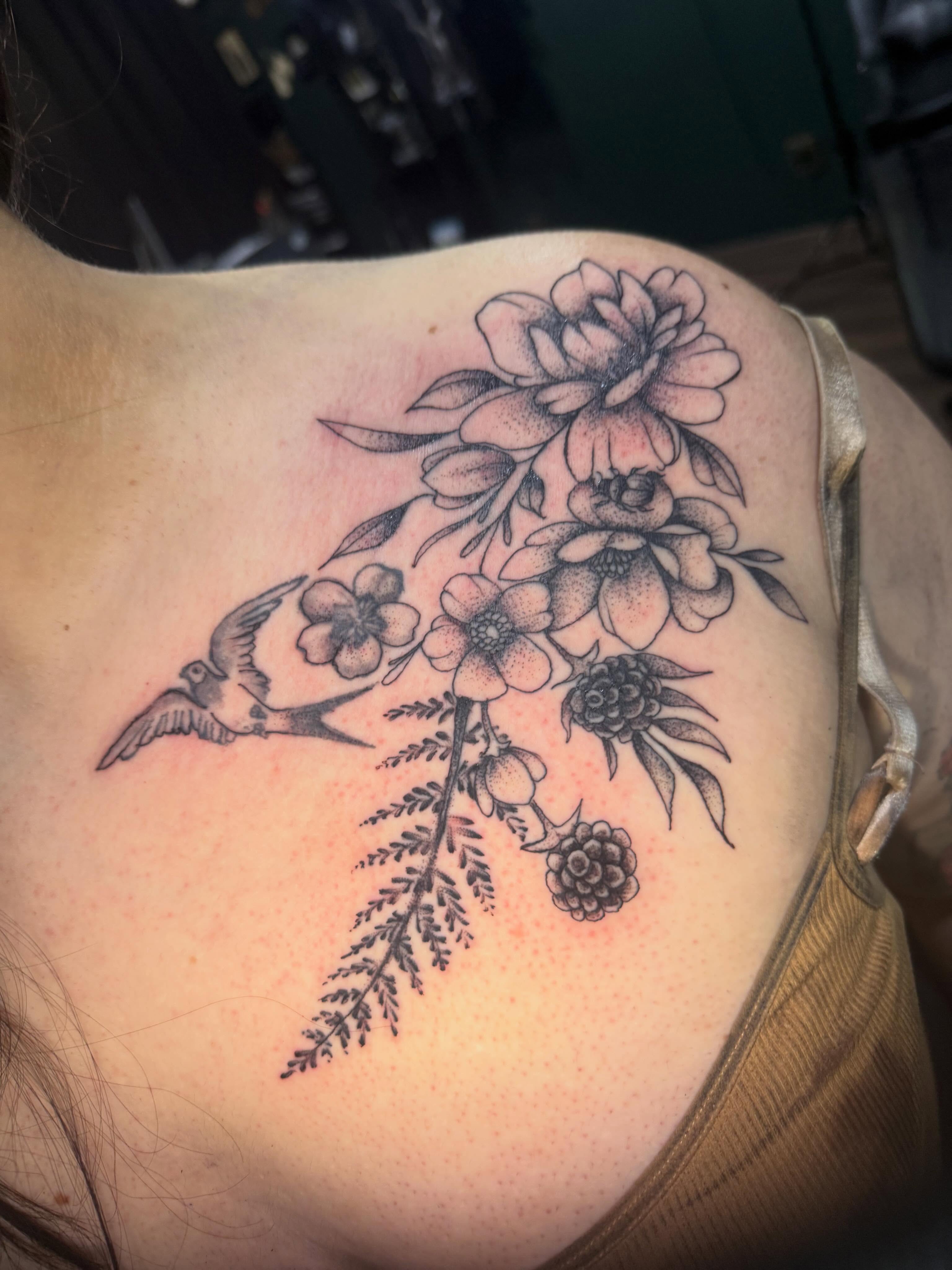 Floral bouquet with bird dotwork tattoo on the shoulder by Teara faith krigbaum