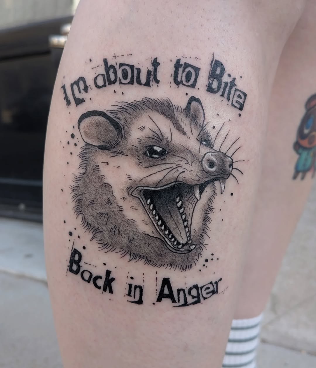 Opossum with text realism tattoo on the thigh by Damon 🥀