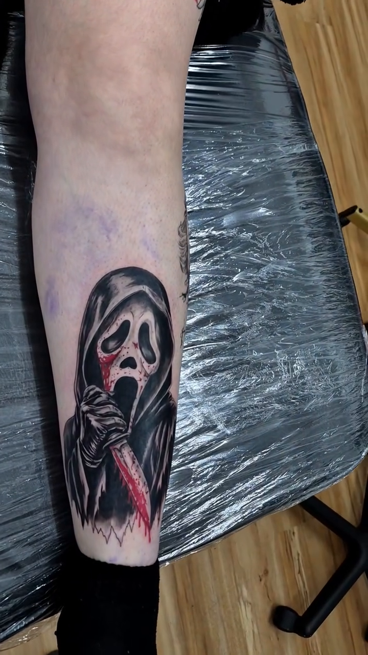 Ghostface and Pennywise realism tattoo by Chris TL Jones