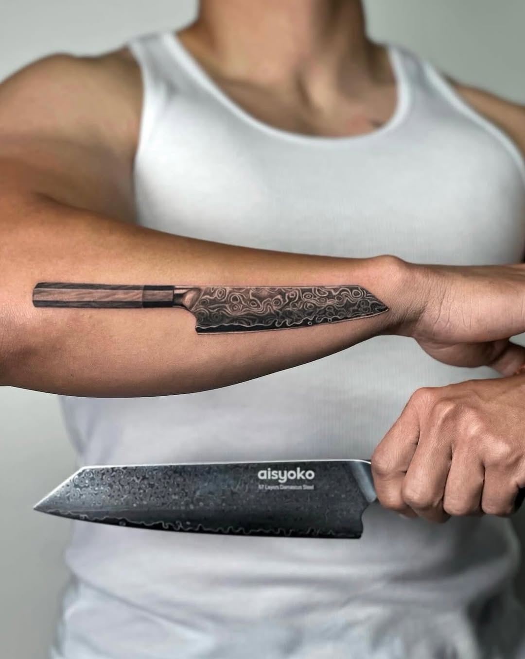Chef's knife tattoo on the forearm by Valery Cardona