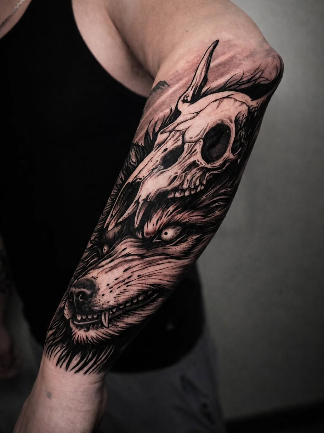 Wolf skull realism tattoo on the forearm by Lukasz Olszanski