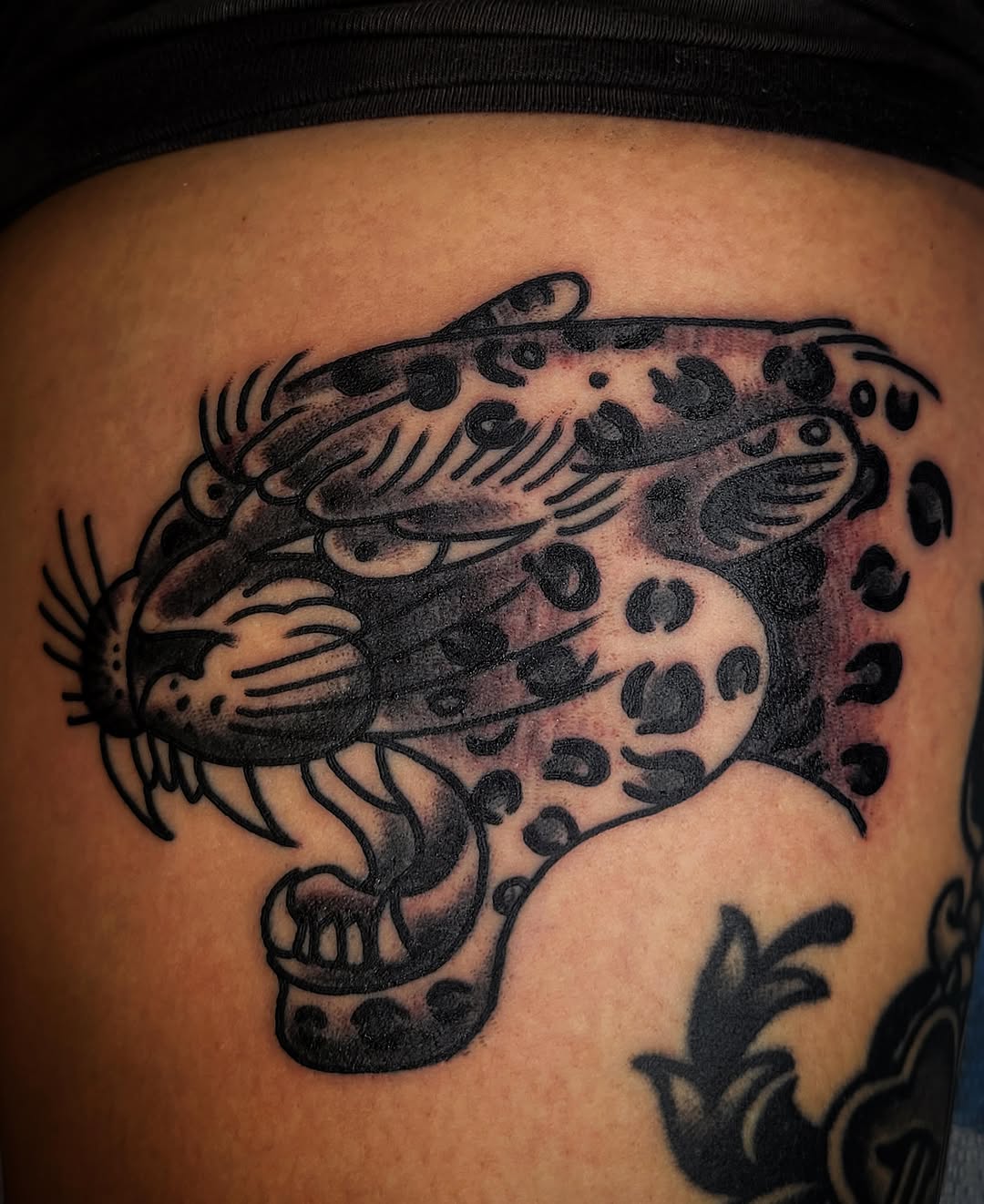 Leopard black and grey tattoo on the thigh by joe martinez, Denver, Colorado