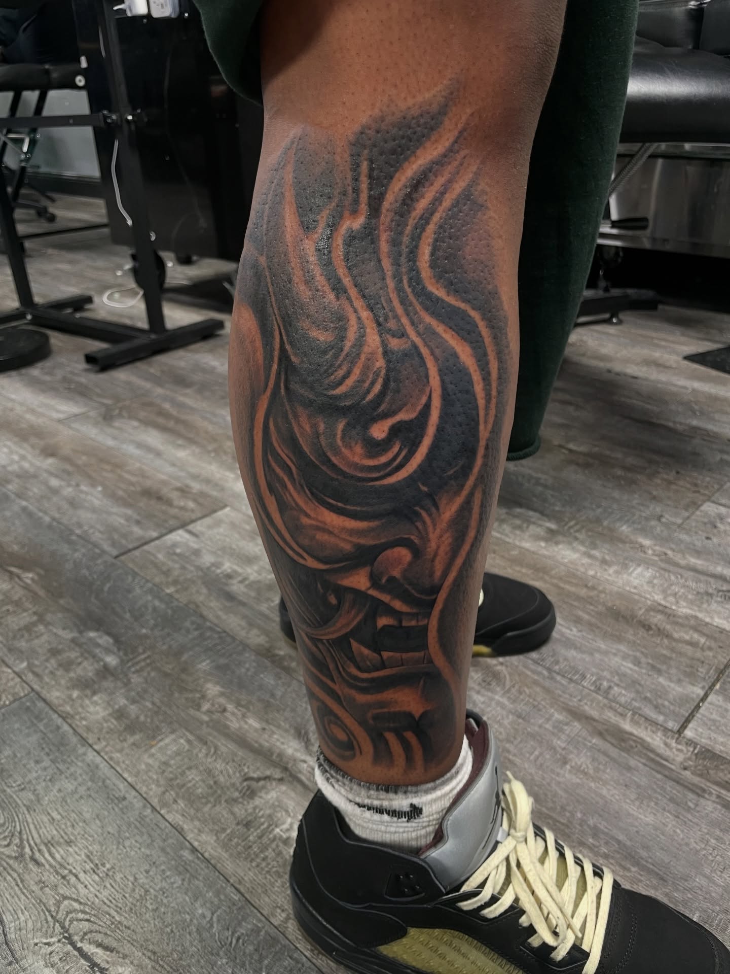 Flame black and grey tattoo on the leg by Shaunboweink