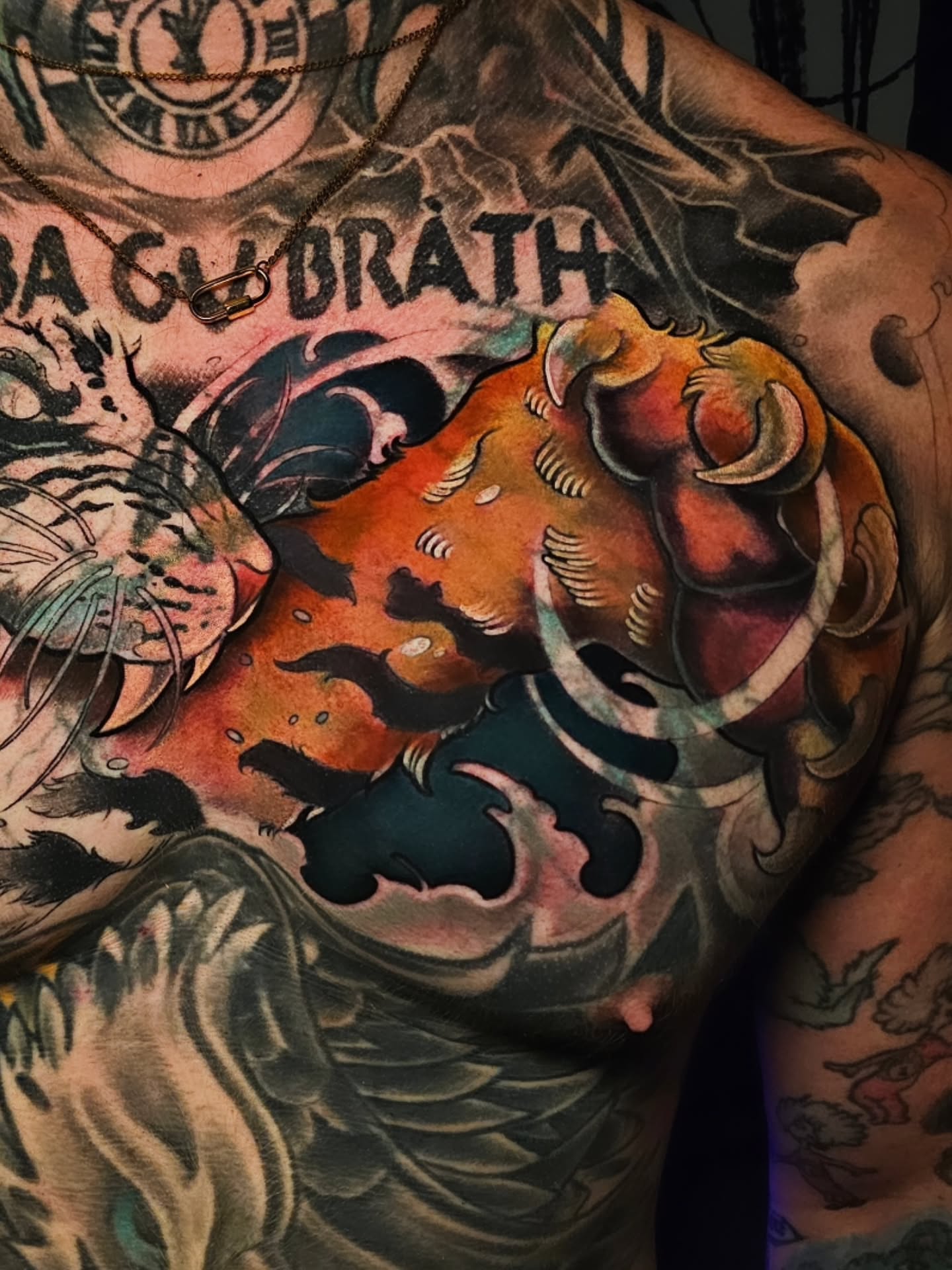Lion American traditional tattoo on the chest by Adriannah Esparza