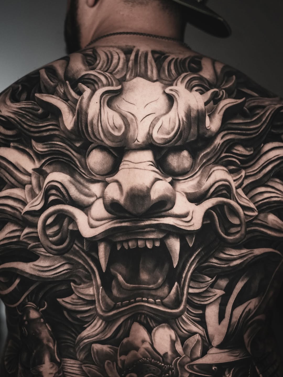 Lion head Japanese tattoo on the back by Claude Steven Estrada, Las Vegas, Nevada